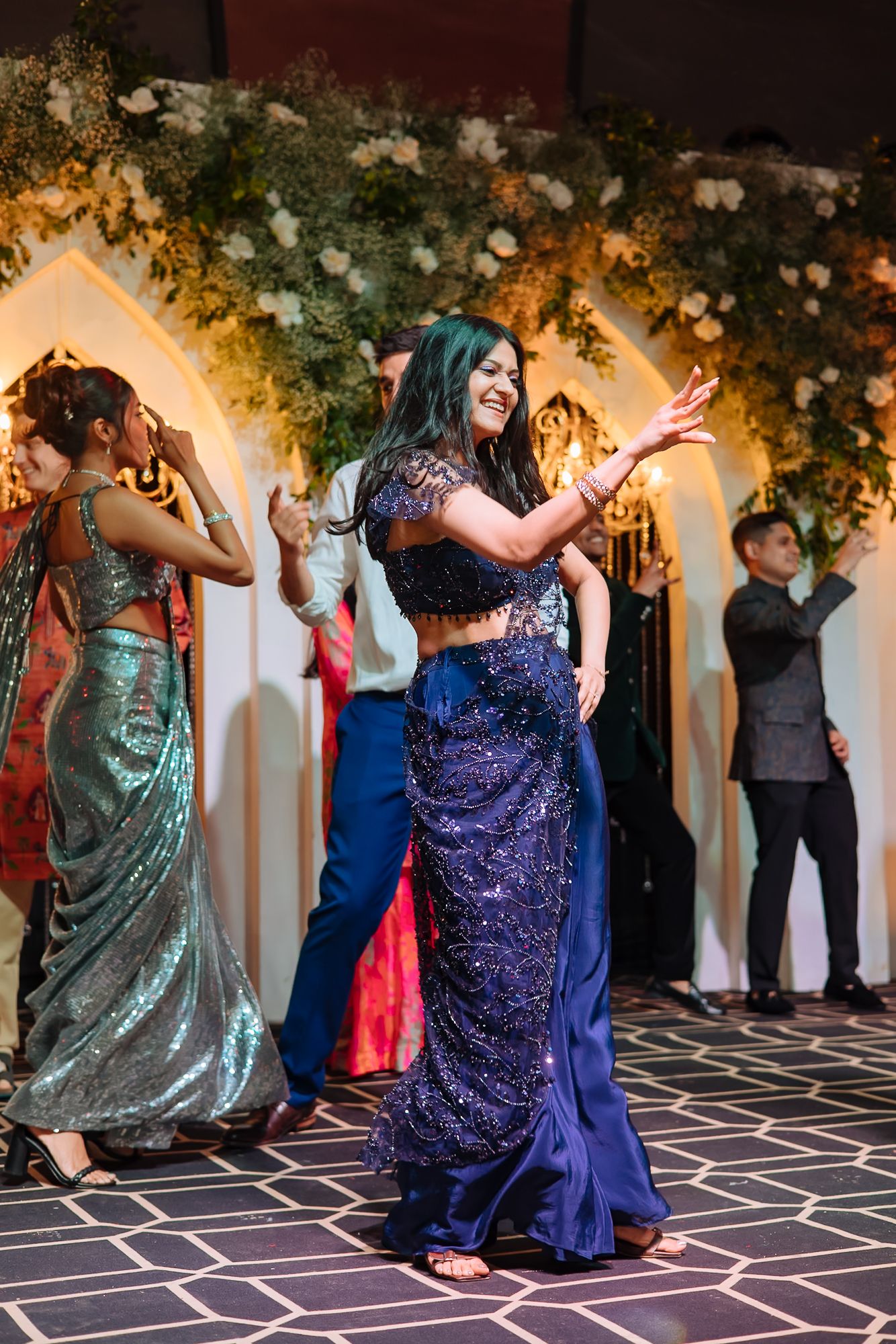 Friends performing an energetic dance for Shorye and Leah at Tivoli Chattarpur