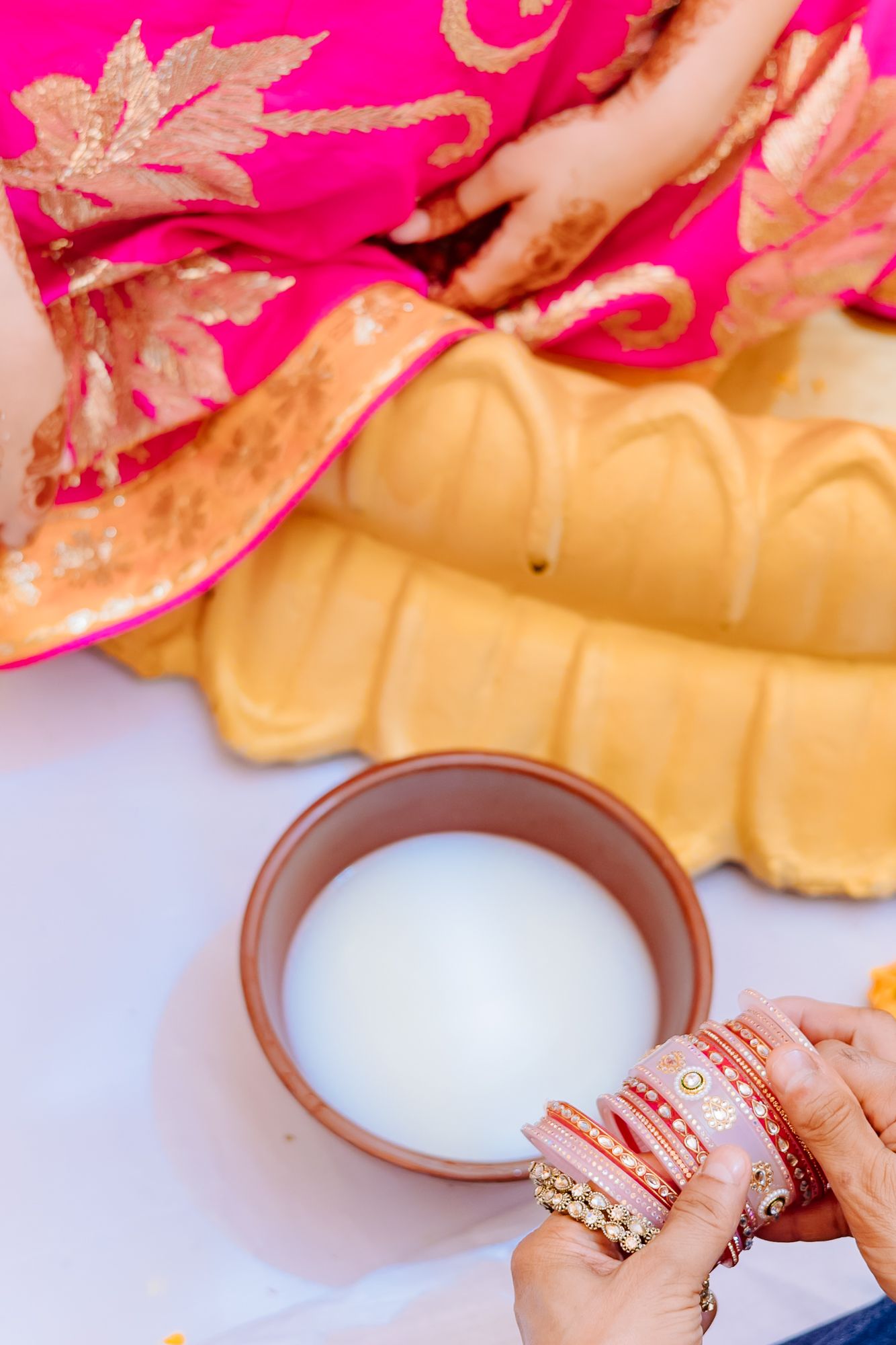 Bride-to-be Leah receiving her traditional bridal chooda during the ceremony at Tivoli Chattarpur