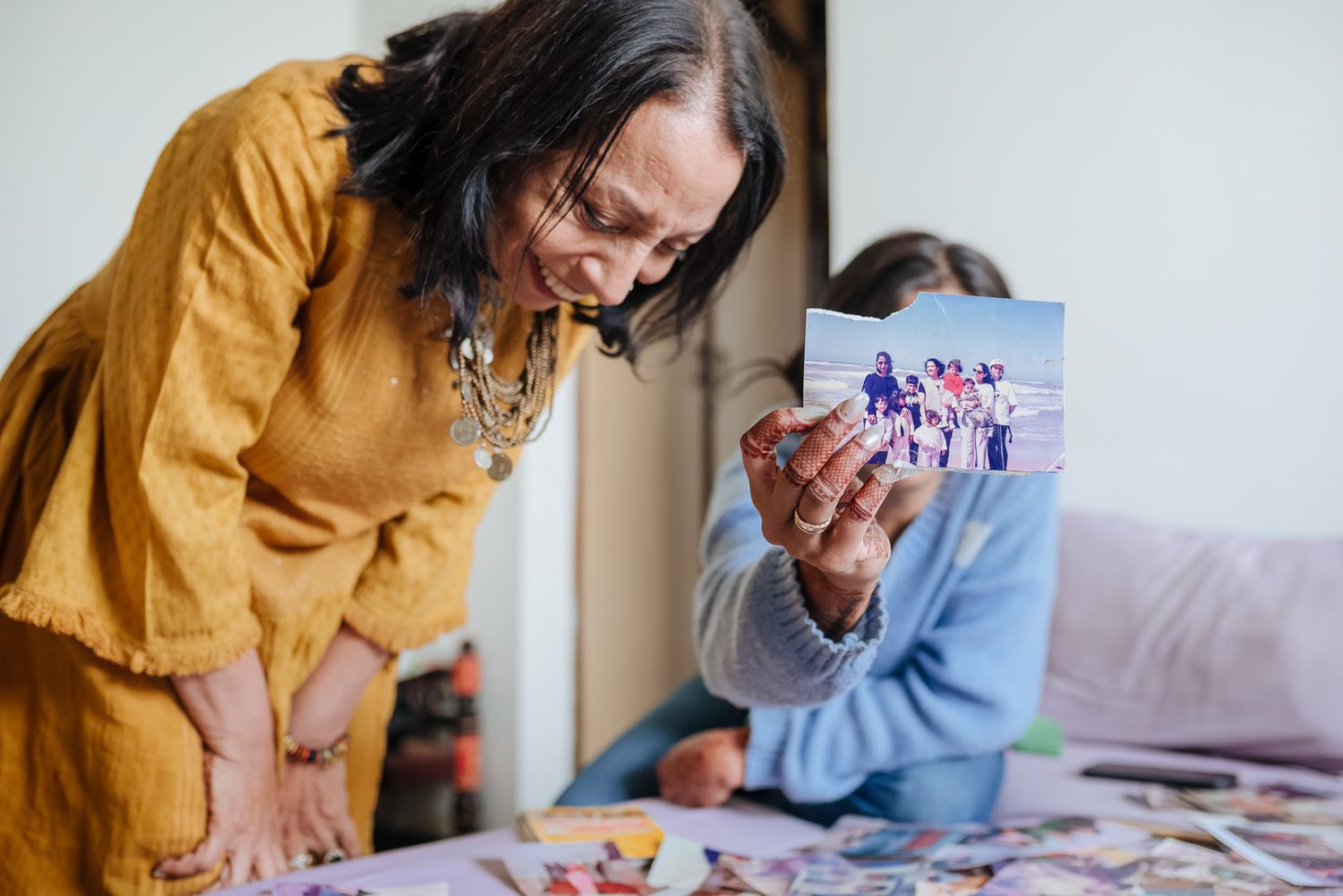 Emotional storytelling wedding photograph of a bride with treasured family memories by Luxury candid wedding photography capturing nostalgia