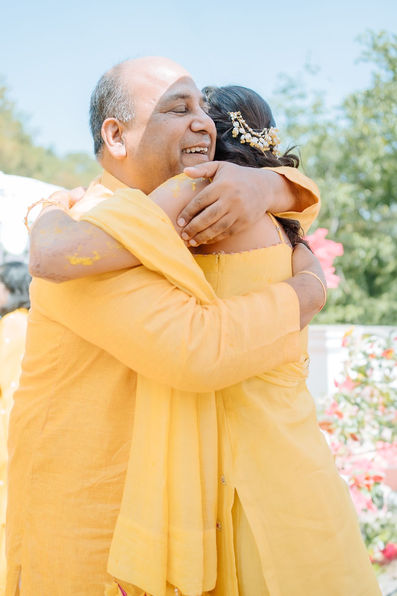 Colorful and candid Haldi moments captured by Fine-art and candid Indian wedding photography and films team Beginnings For You.