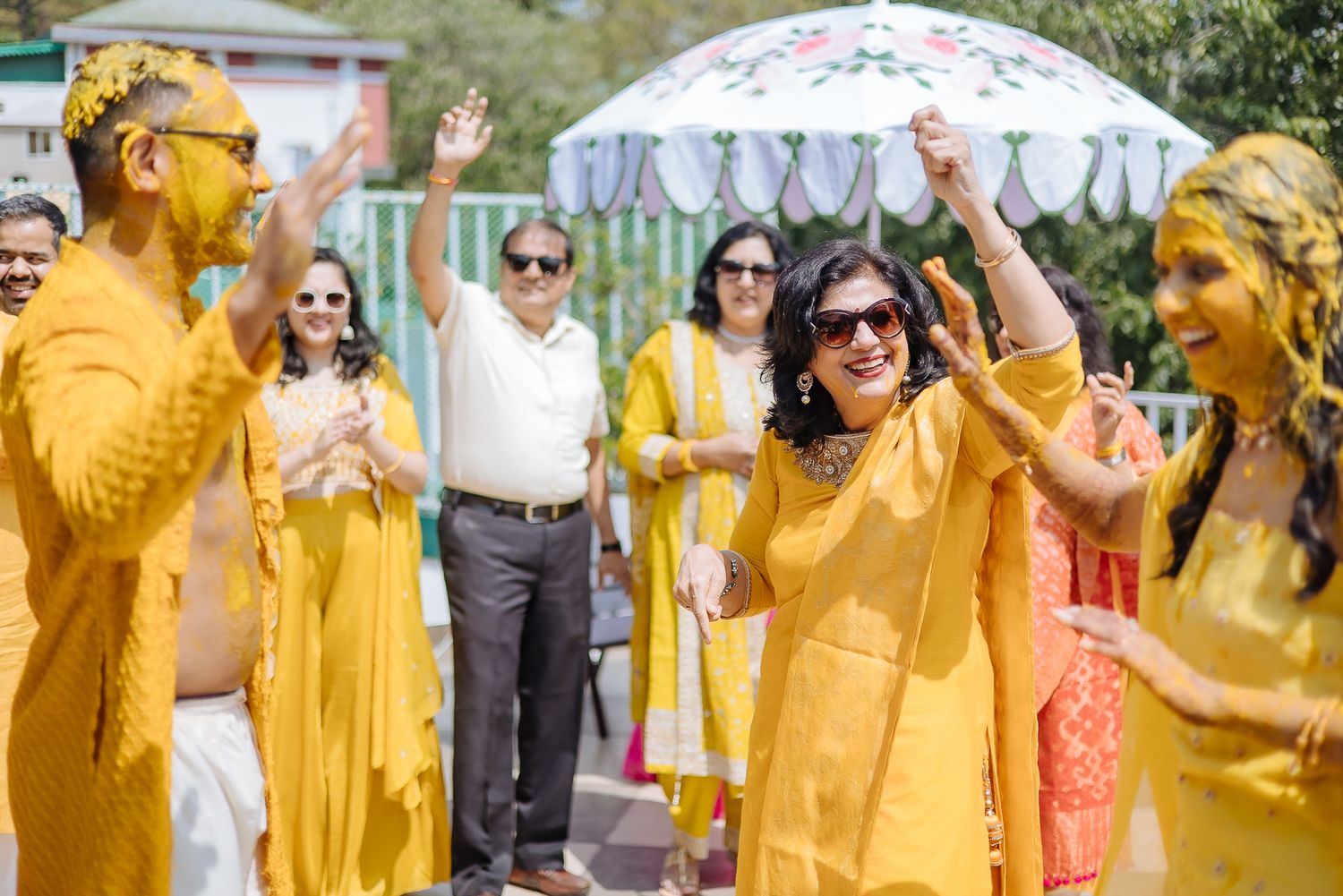 Colorful and candid Haldi moments captured by Fine-art and candid Indian wedding photography and films team Beginnings For You.