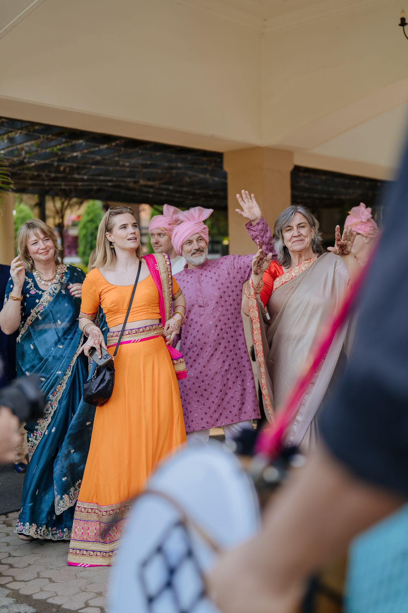 Joyful baraat with the groom's Norwegian family celebrating in Indian attire for an Indo-Norwegian fusion wedding in Forest Hill Chandigarh