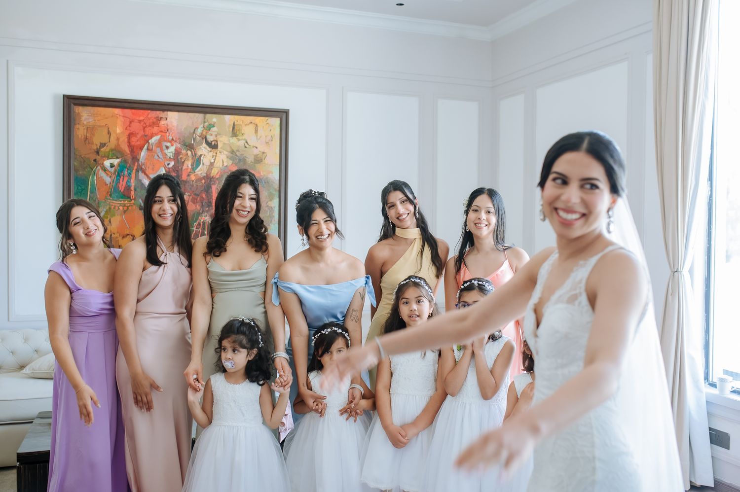Leah sharing a joyful moment with her bridesmaids before the Christian wedding at Tivoli Chattarpur.