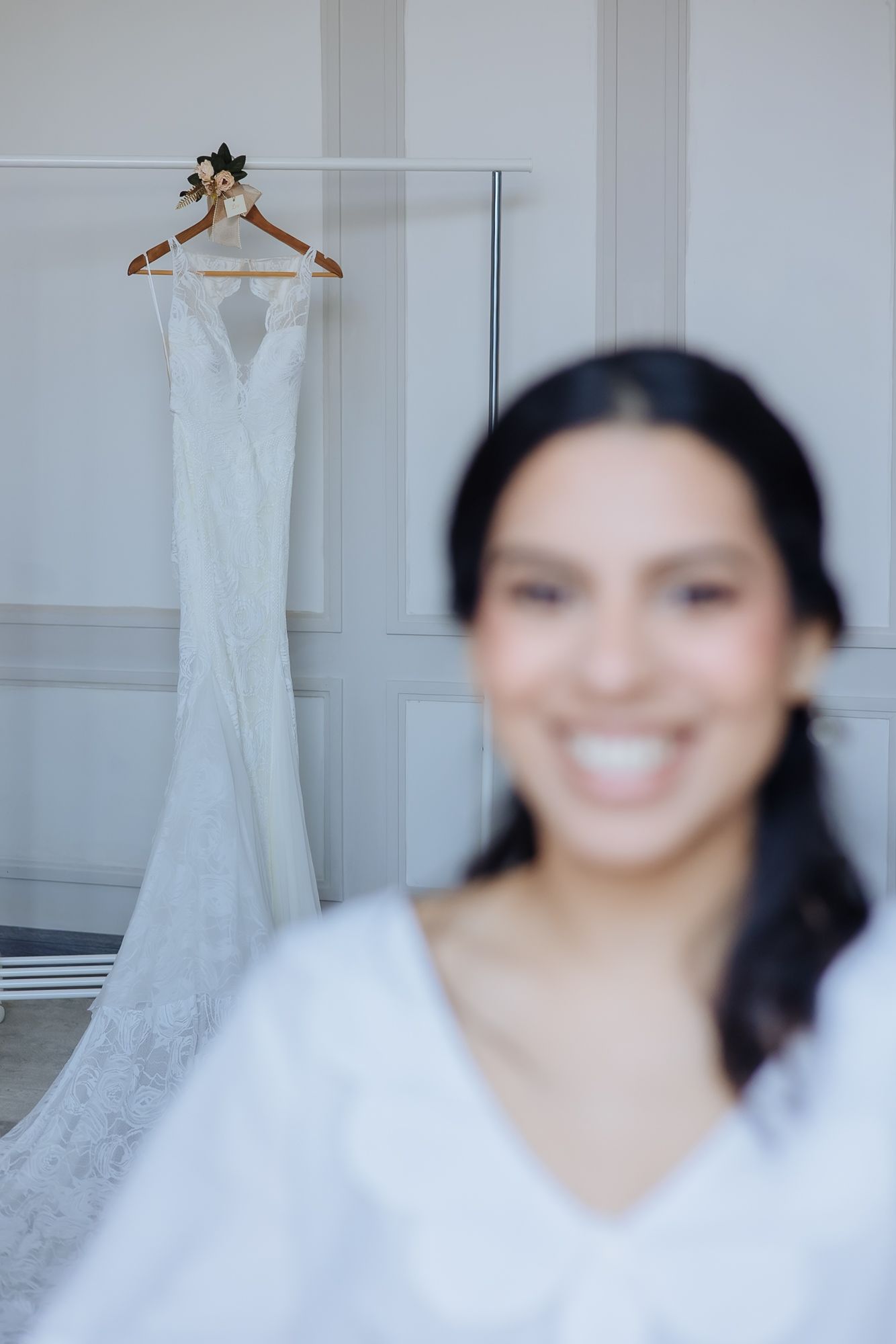 Leah posing in her white wedding dress before the ceremony at Tivoli Chattarpur.
