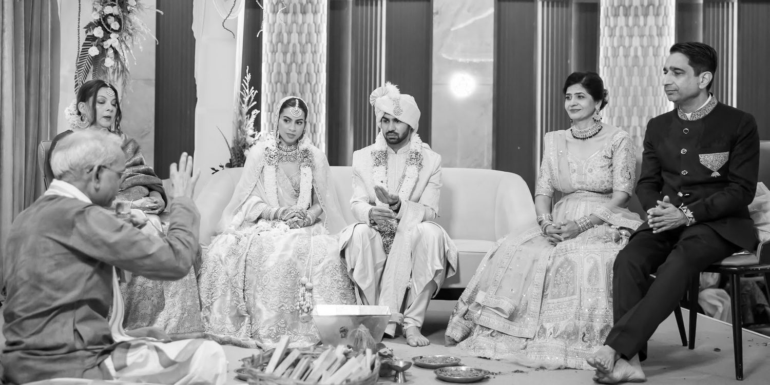 Shorye and Leah performing their wedding pheras indoors at Tivoli Chattarpur