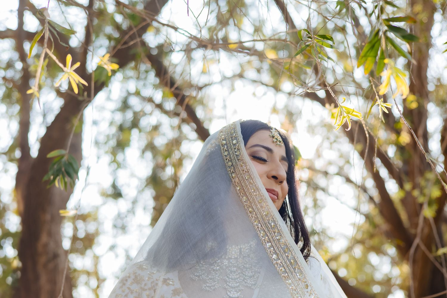 Elegant bridal portrait of Bride Itisha in an ivory lehenga for an intimate Indo-Norwegian wedding in Forest Hill, Chandigarh