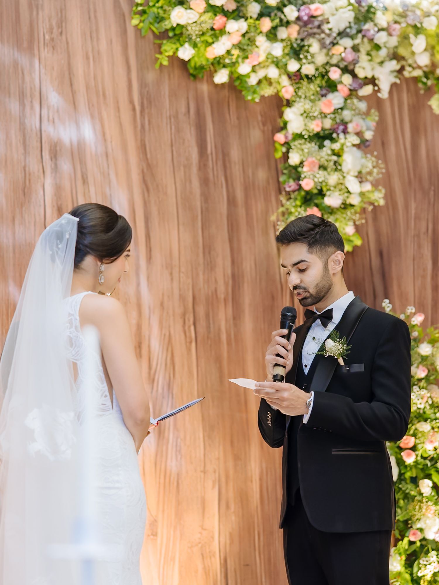 Shorye and Leah exchanging emotional vows during their Christian wedding at Tivoli Chattarpur