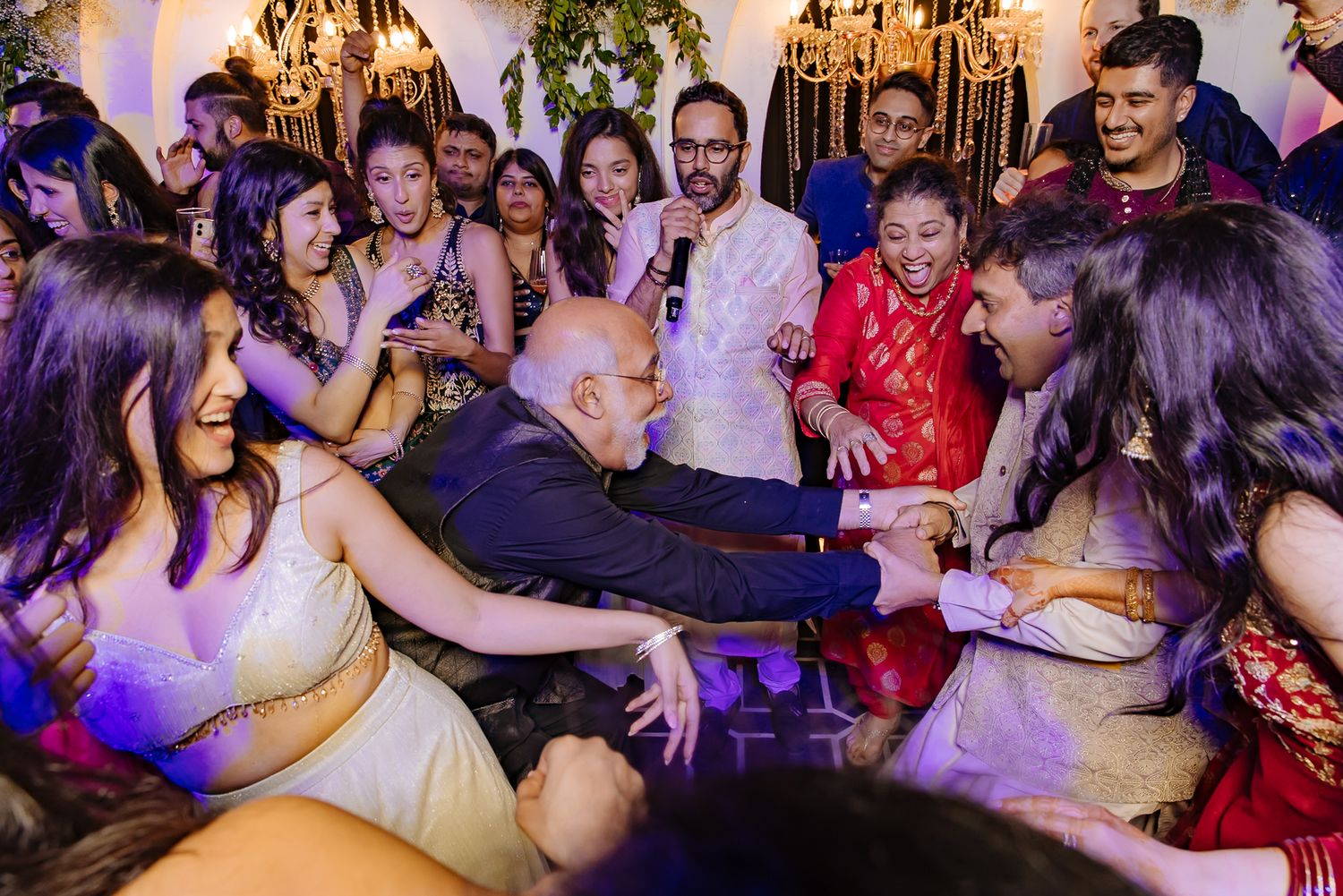 Bride and groom leading an unforgettable dance battle at their wedding celebration at Tivoli Chattarpur