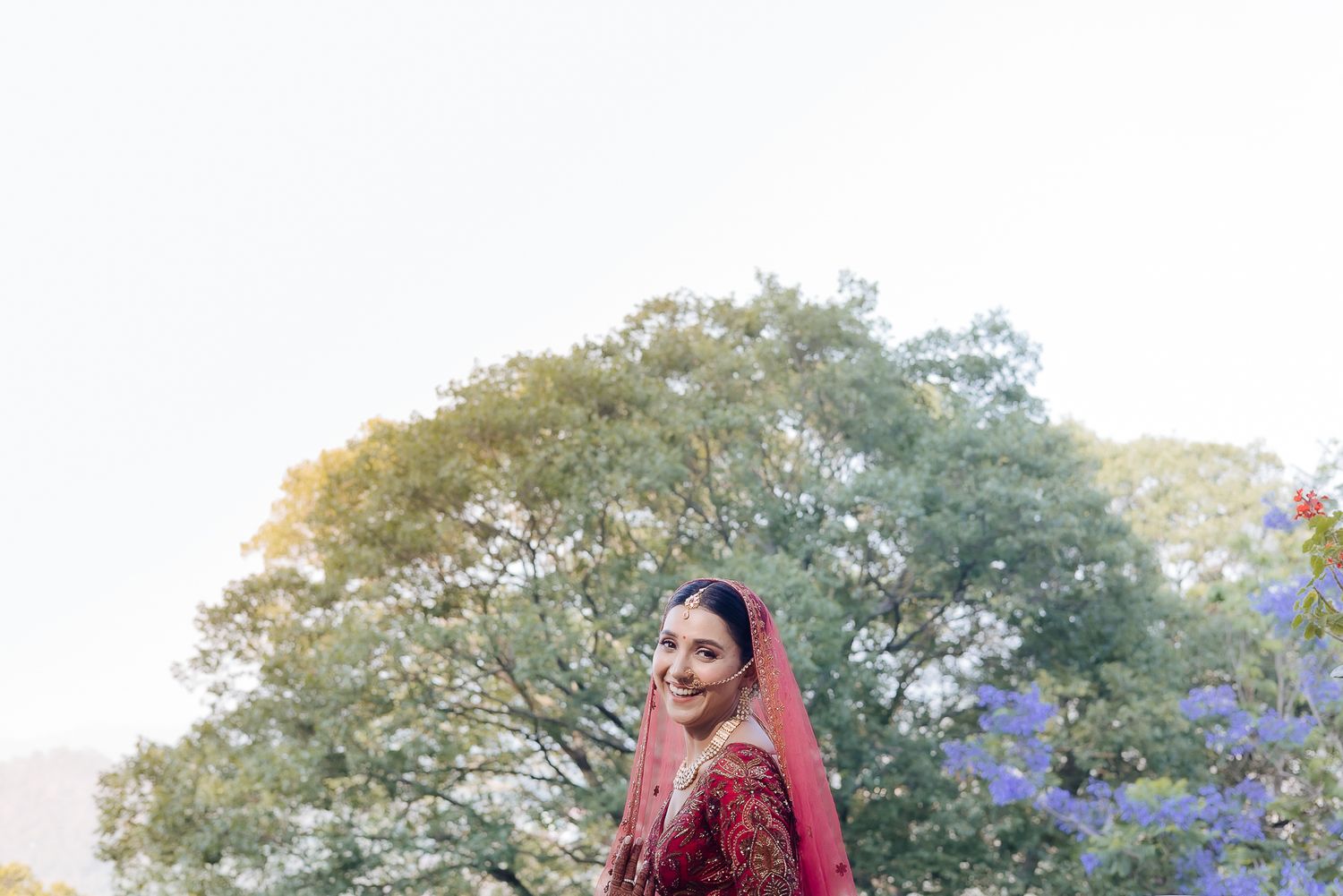 Indian bride in Maroon lehenga with fine-art portraits for an intimate wedding of 30 people in the hills at Daleside Manor, Kasauli