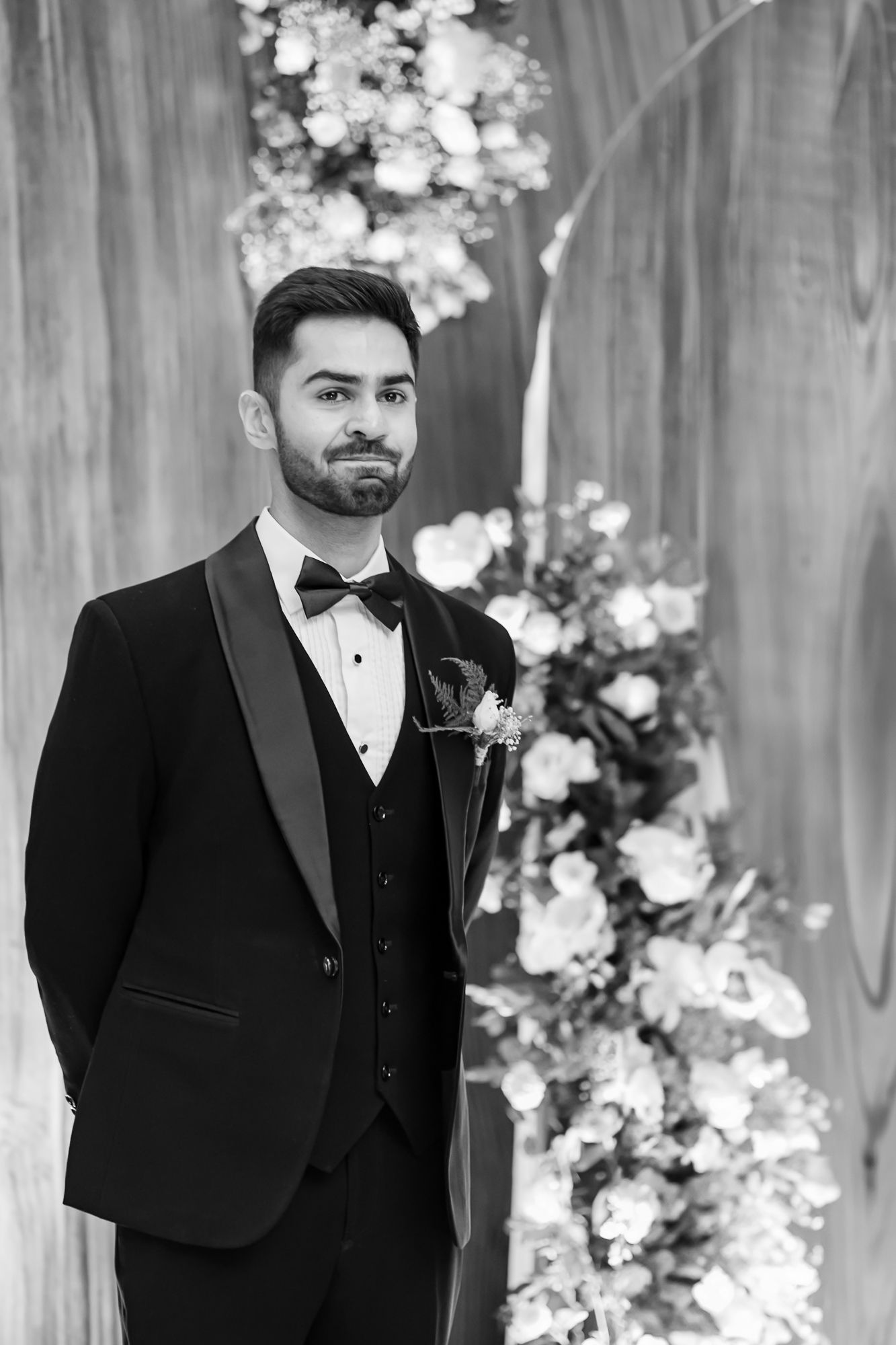 Groom Shorye's reaction as Leah walking down the aisle with her mother during her Christian wedding ceremony at Tivoli Chattarpur