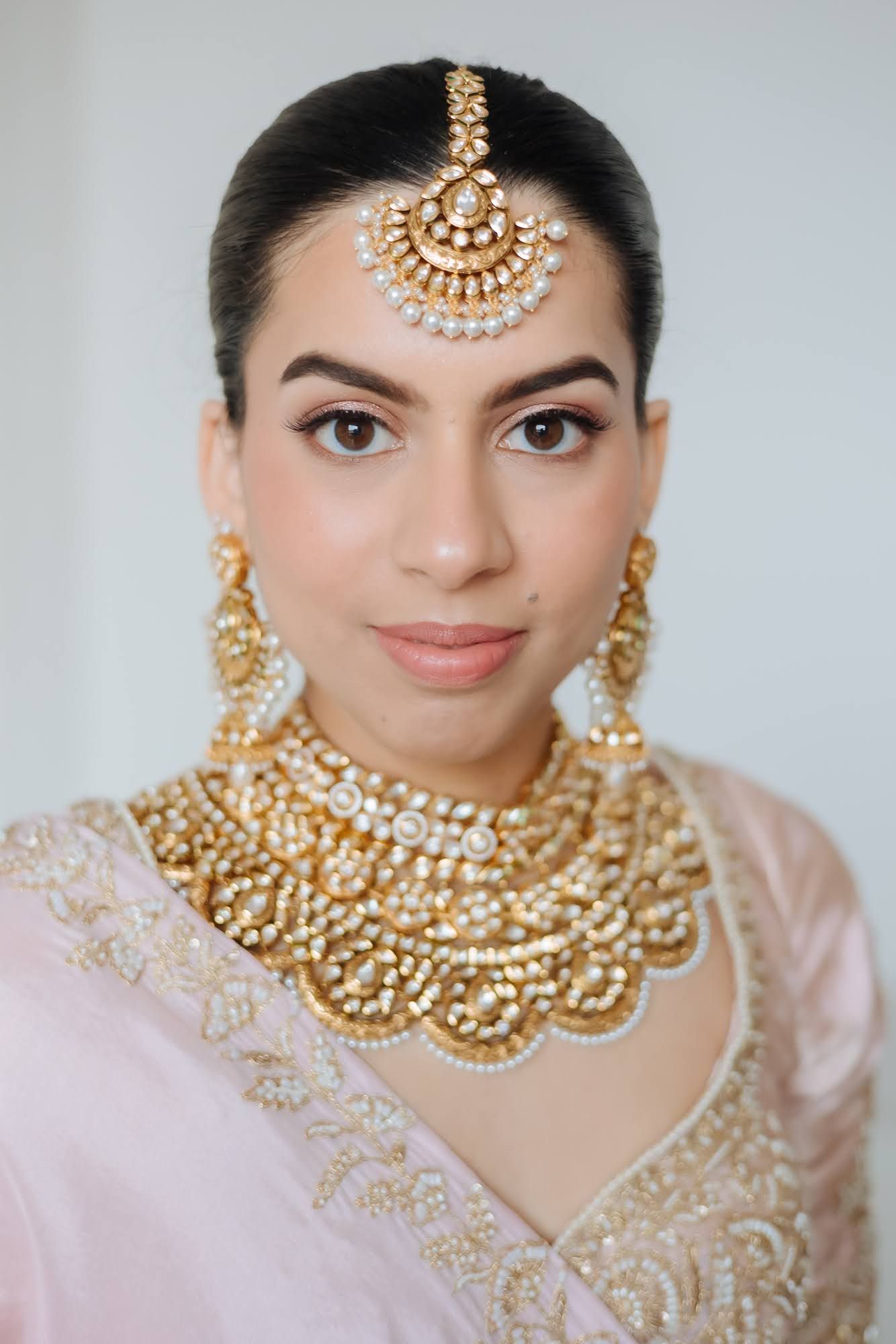 Bride Leah embracing a soft pastel bridal palette for her Punjabi wedding at Tivoli Chattarpur