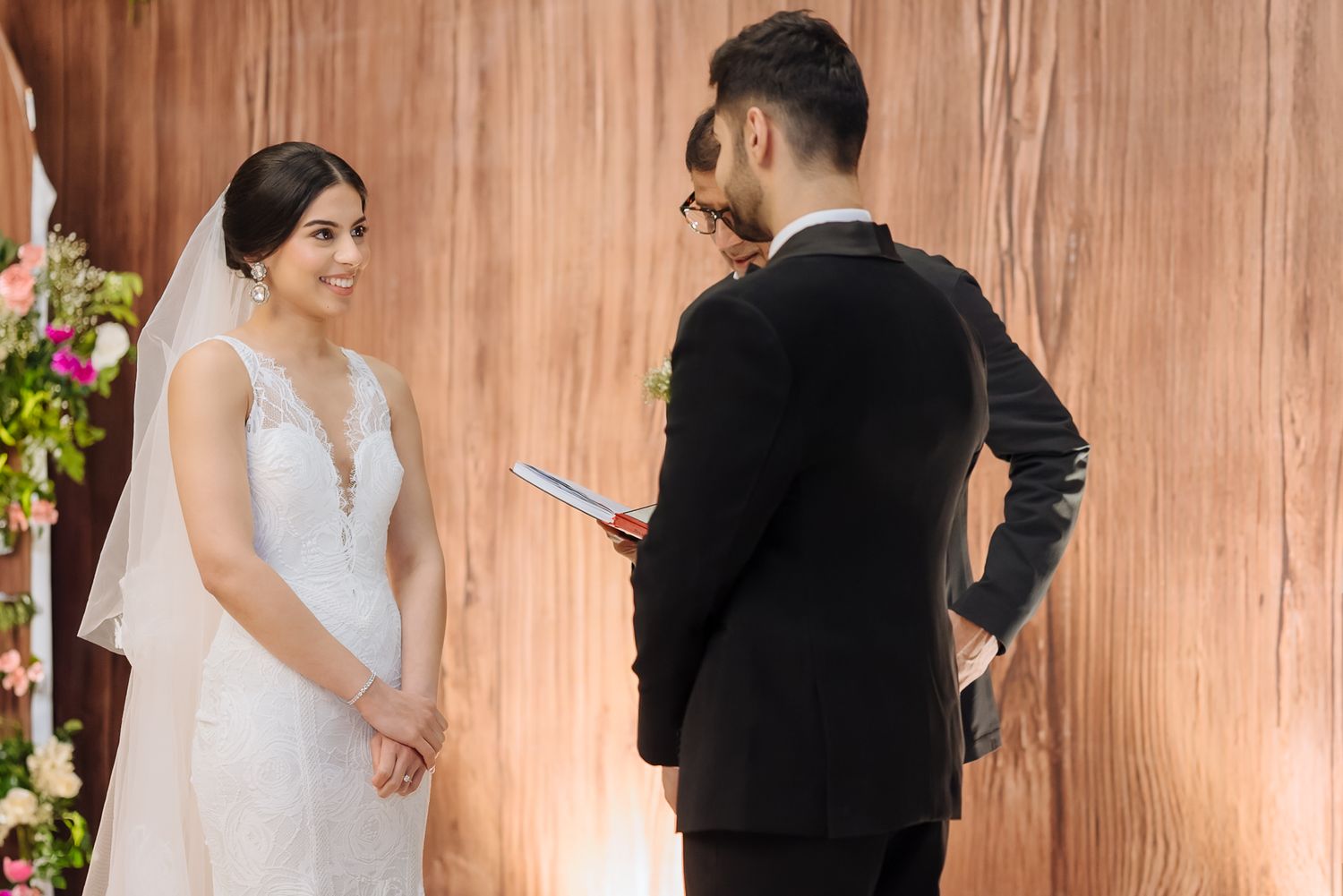 Shorye and Leah exchanging emotional vows during their Christian wedding at Tivoli Chattarpur