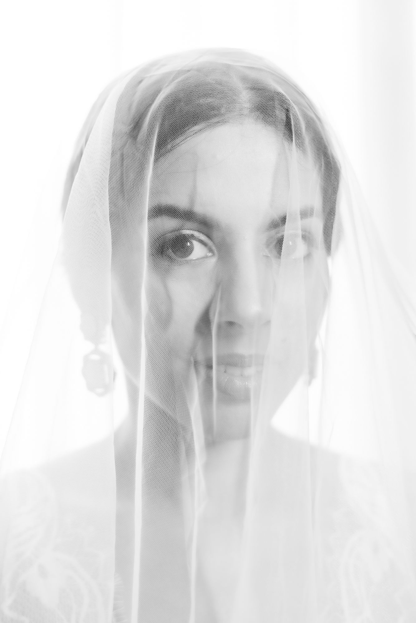 Bride Leah dressed in white for her intimate Christian wedding at Tivoli Chattarpur.