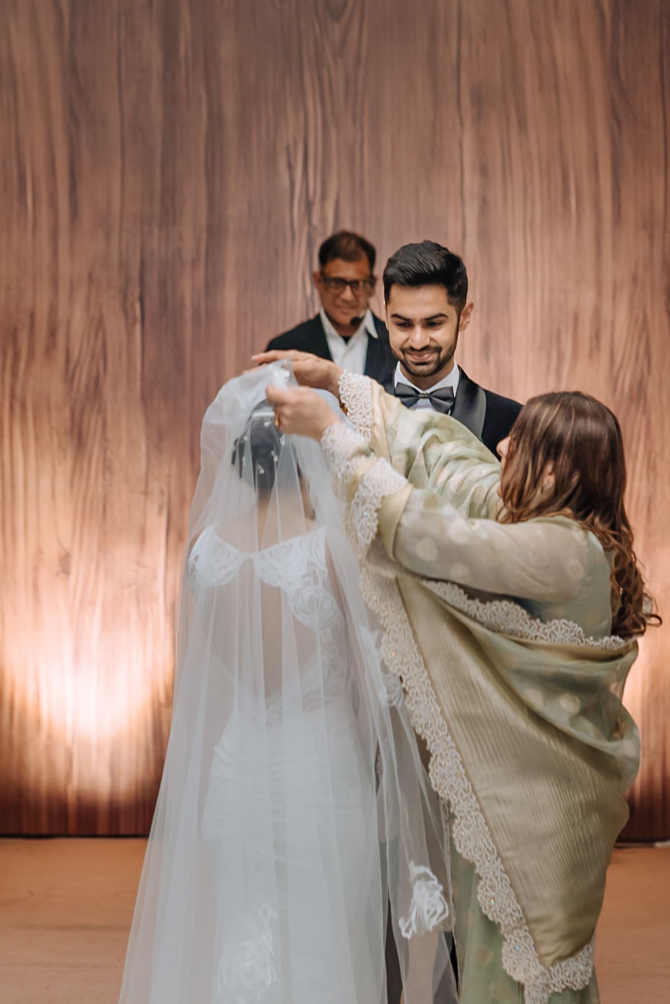 Leah walking down the aisle with her mother during her Christian wedding ceremony at Tivoli Chattarpur