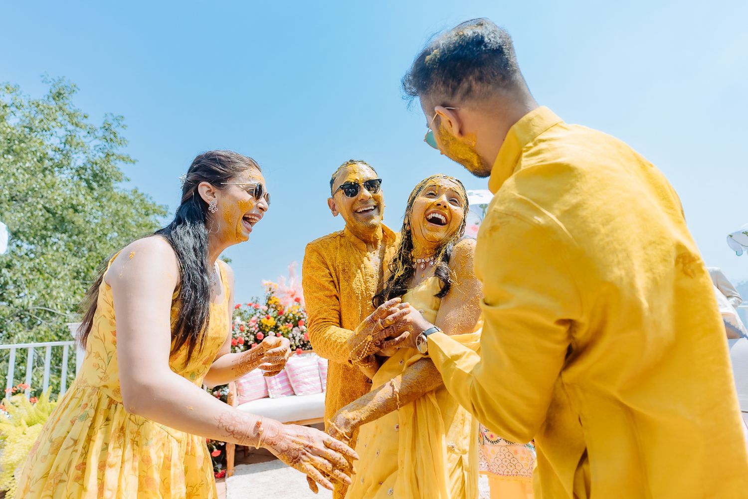 Colorful and candid Haldi moments captured by Fine-art and candid Indian wedding photography and films team Beginnings For You.