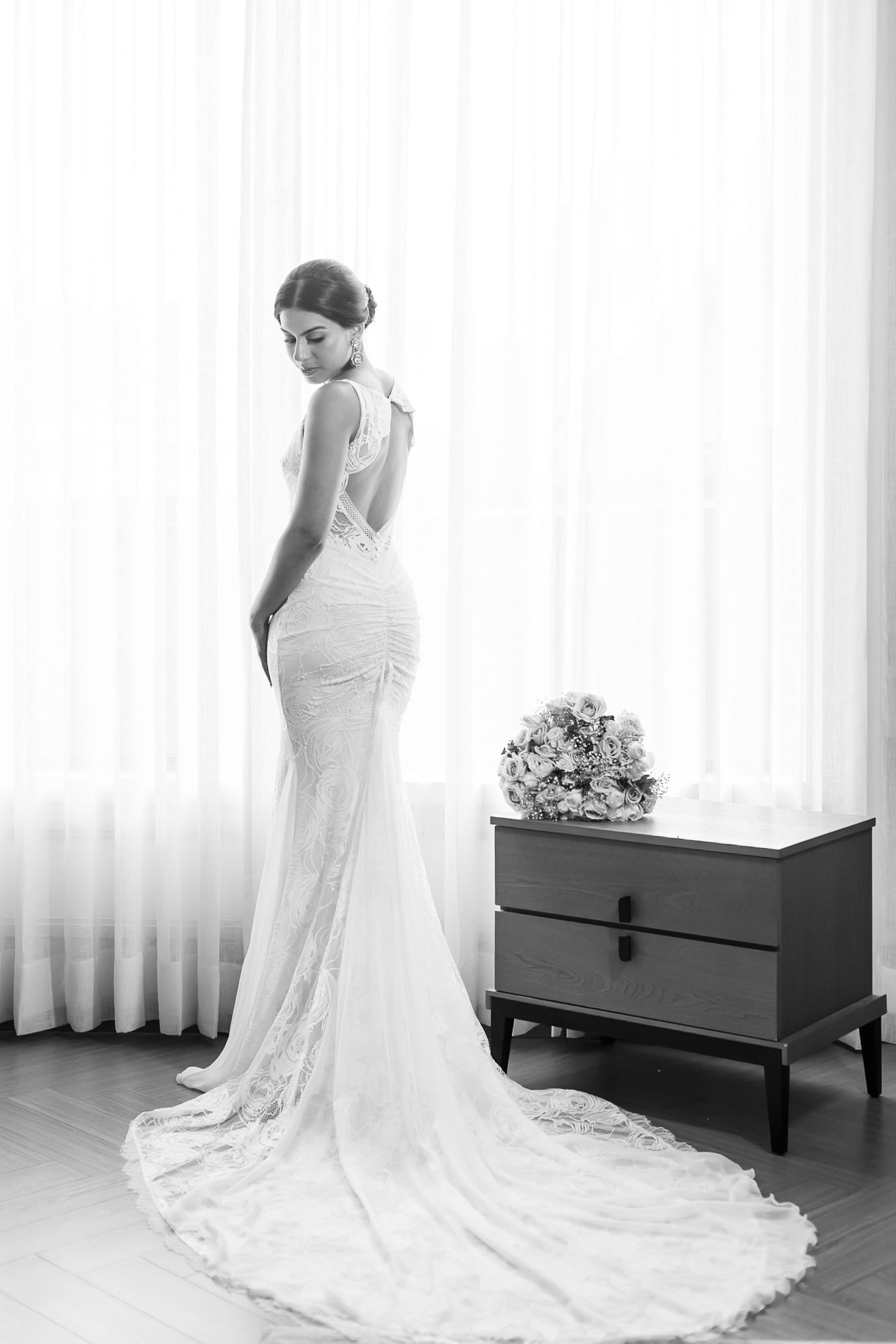 Bride Leah dressed in white for her intimate Christian wedding at Tivoli Chattarpur.