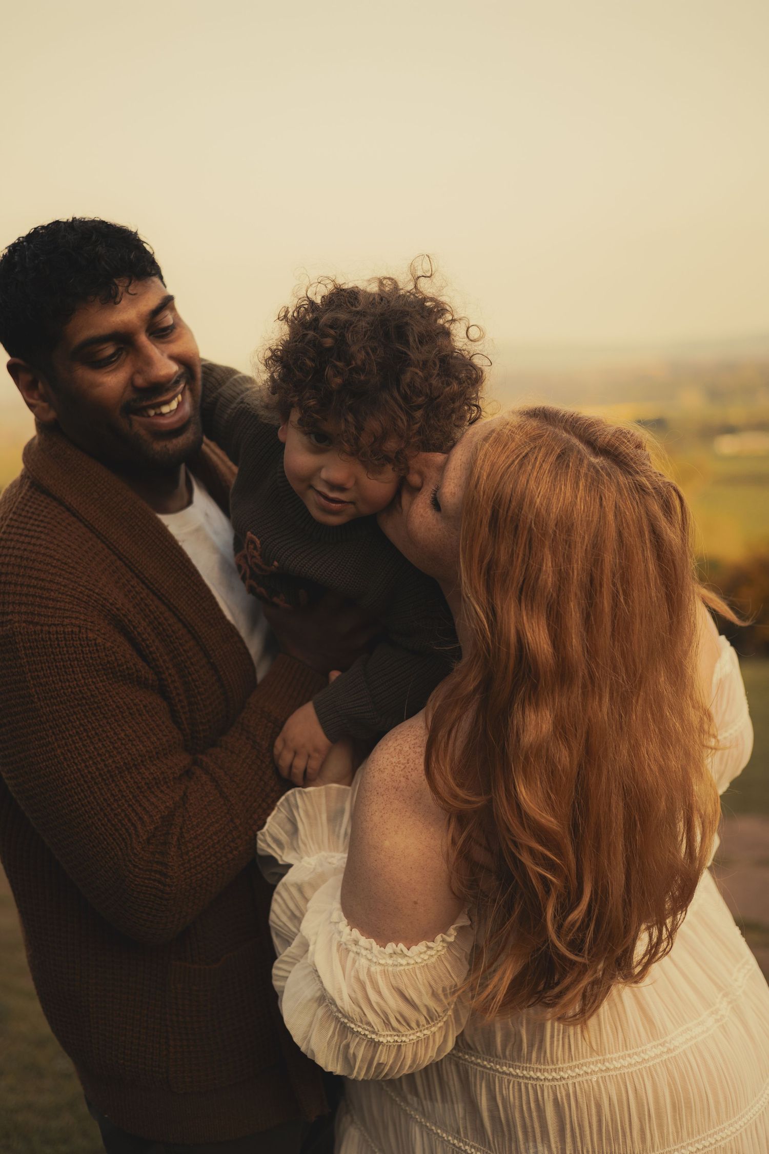 Family smiling and being happy during photoshoot