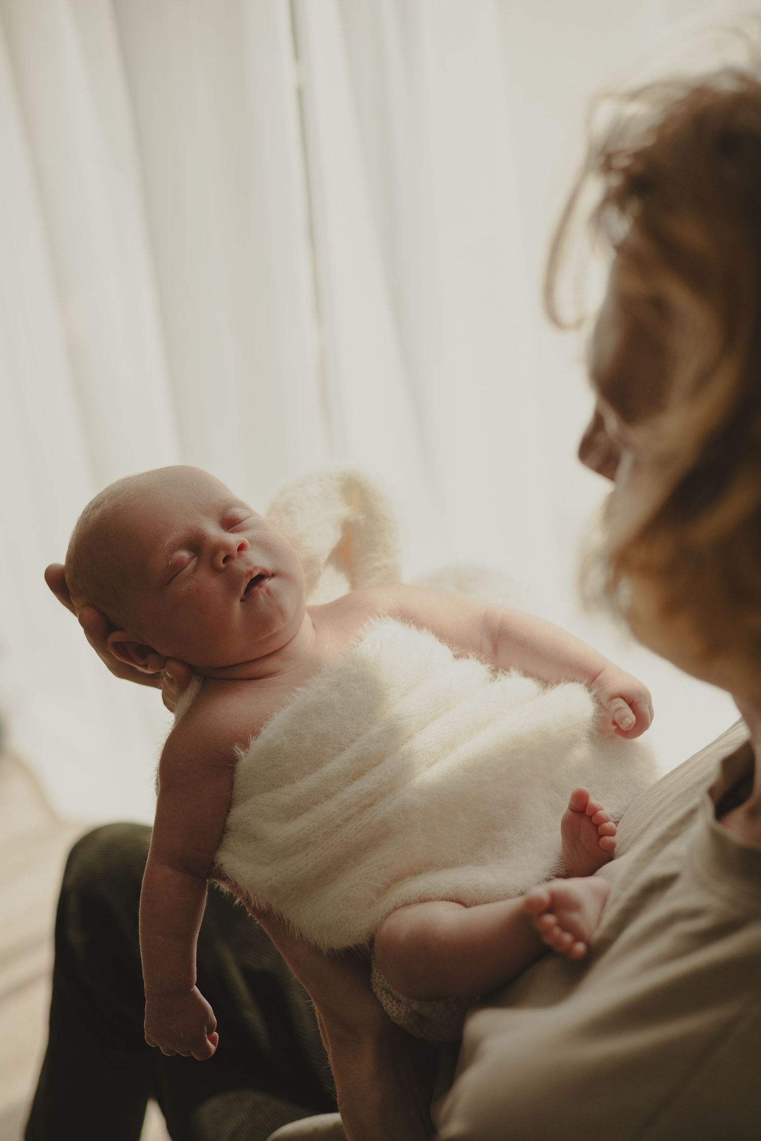 Baby during newborn shoot in Telford.