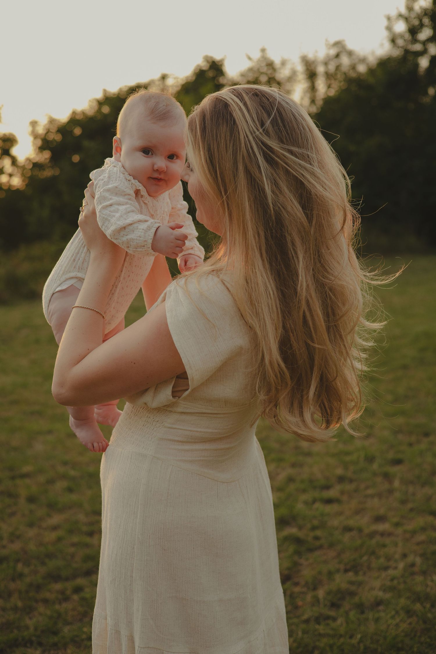 A mother and daughter having a family photoshoot in Shropshire during sunset.