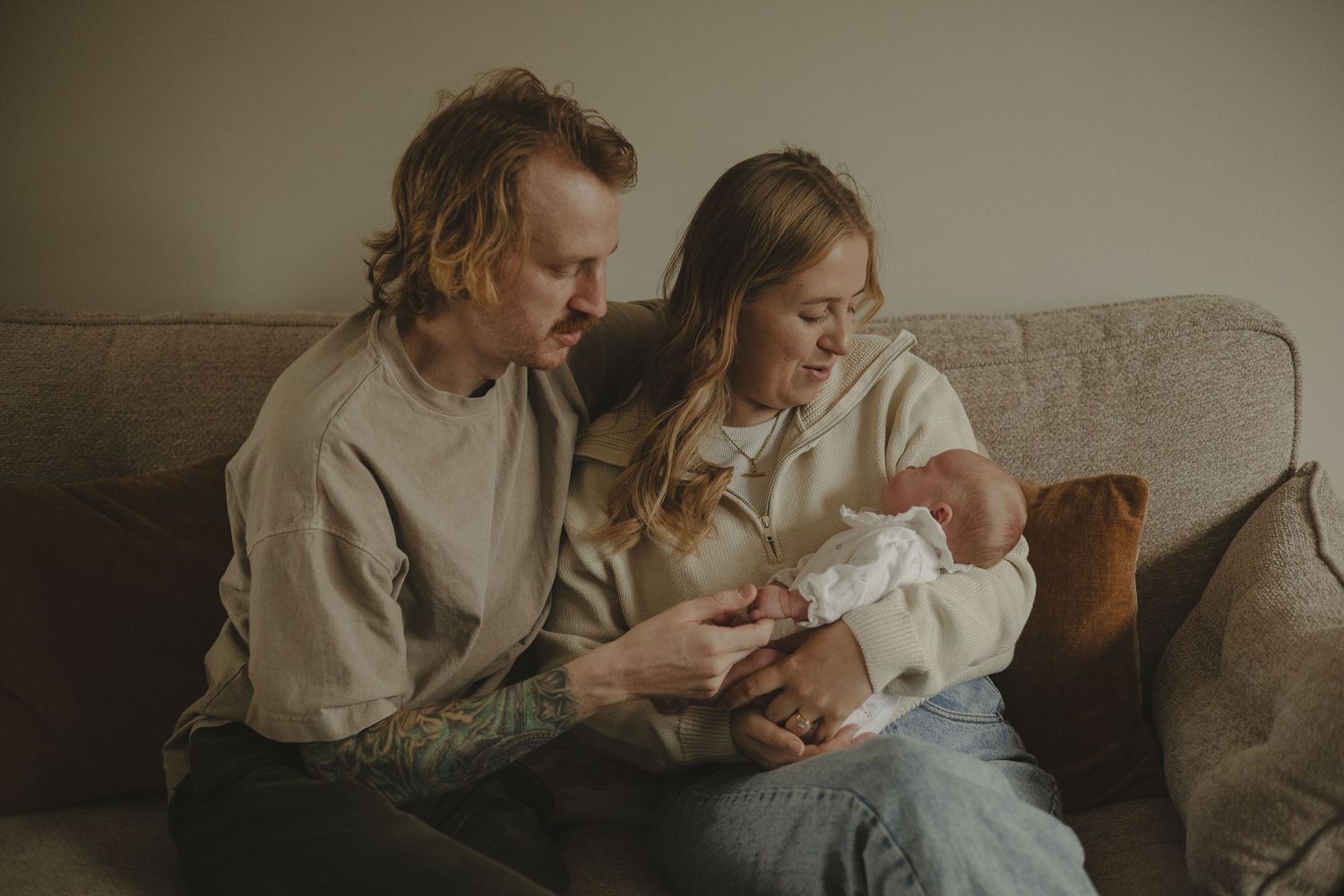 Newborn photoshoot in Telford, looking down at newborn baby.
