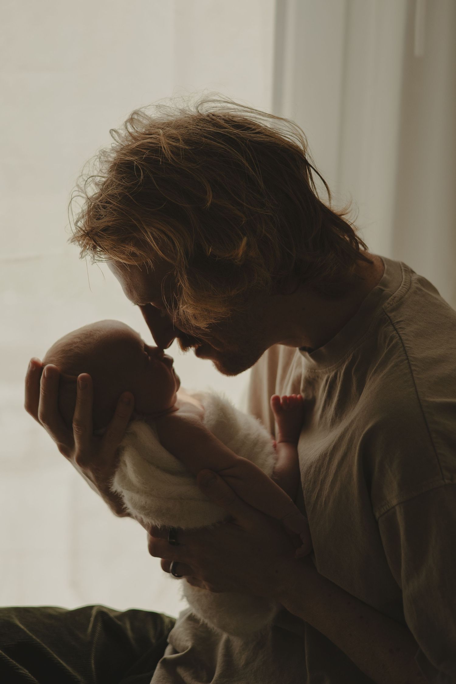 Dad nose to nose during newborn photoshoot in Telford.