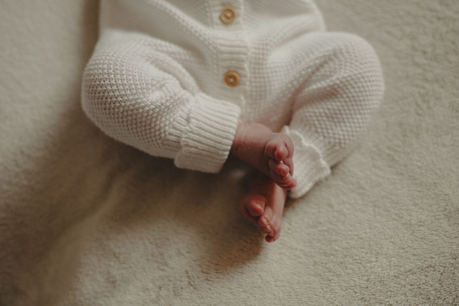 Photo of a newborn babies feet during newborn photography session in Telford.