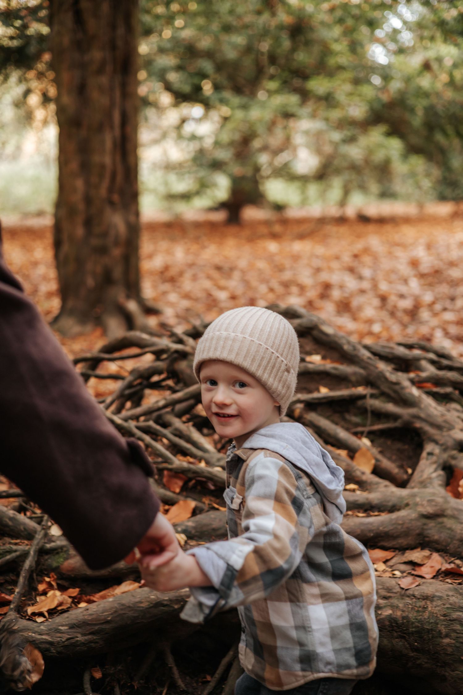 Son holding hands with his mum during photoshoot in Telford, Shropshire.