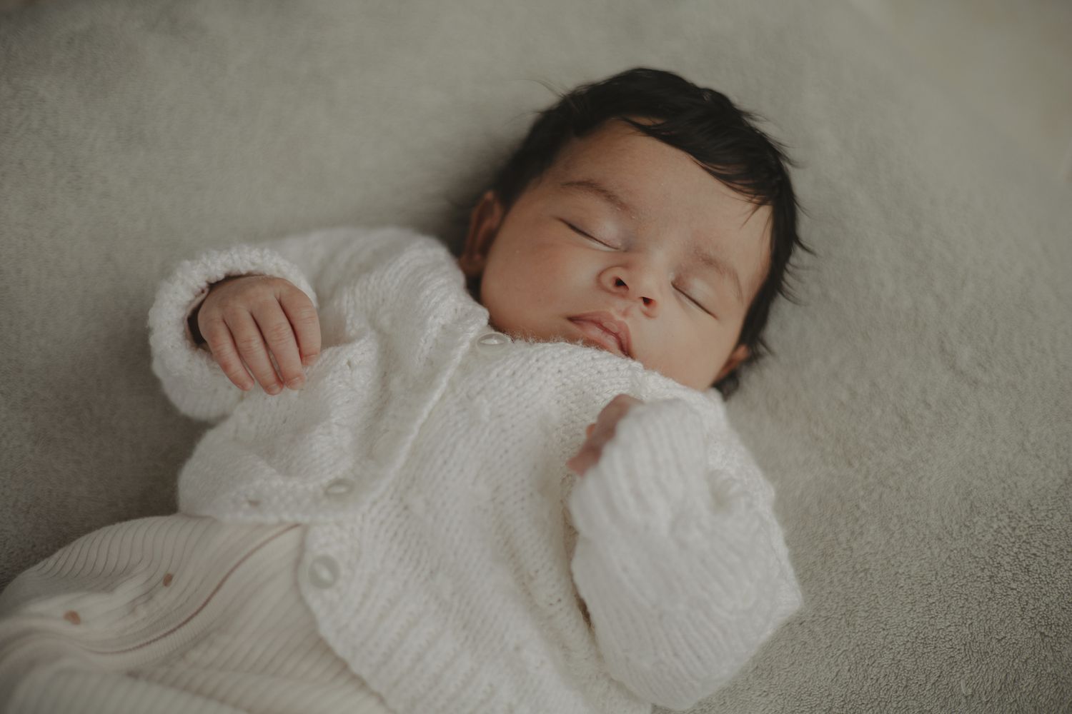 Photo of a newborn baby during newborn photography session in Telford.