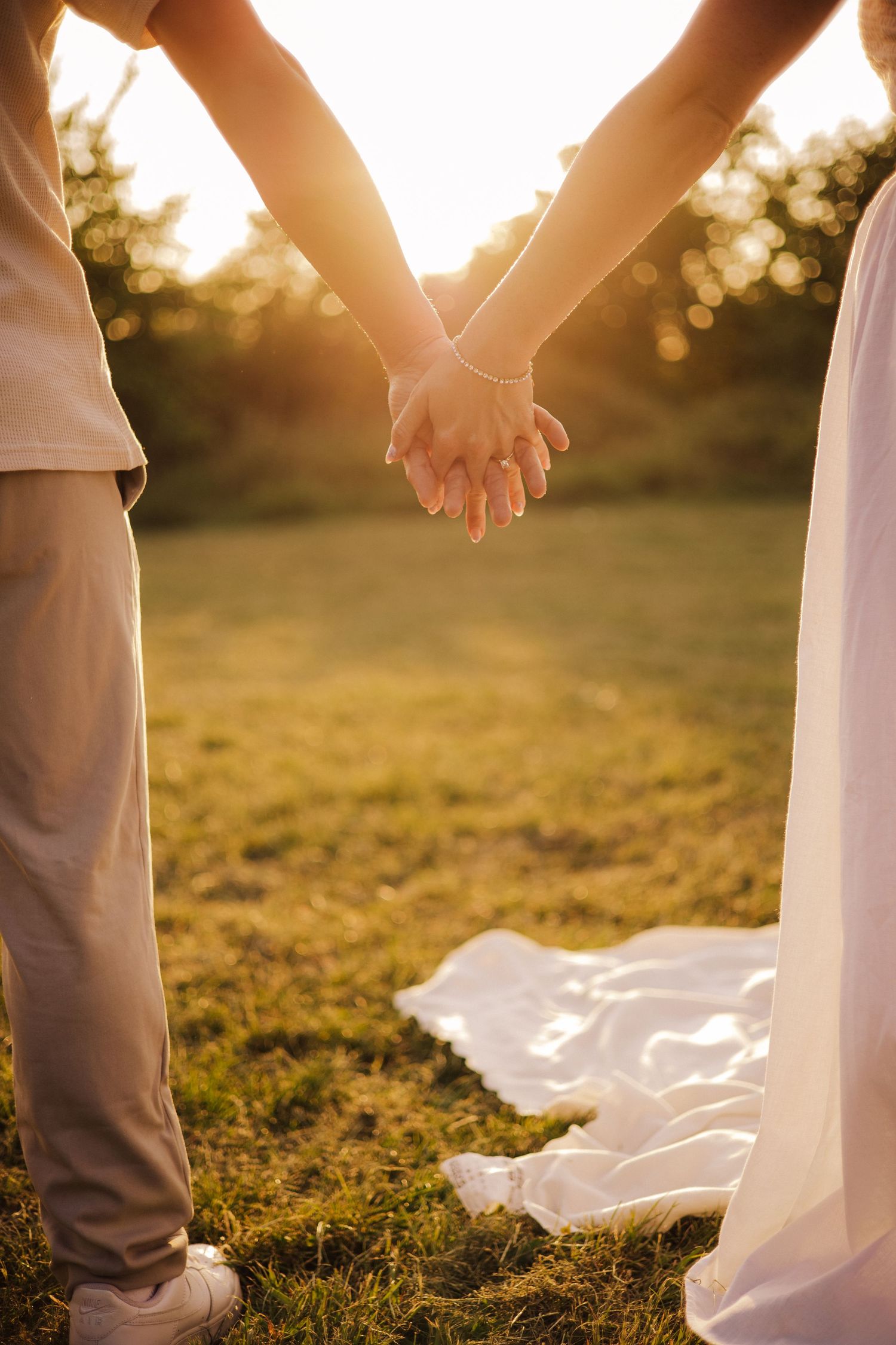 Couple holding hands during shoot in Telford
