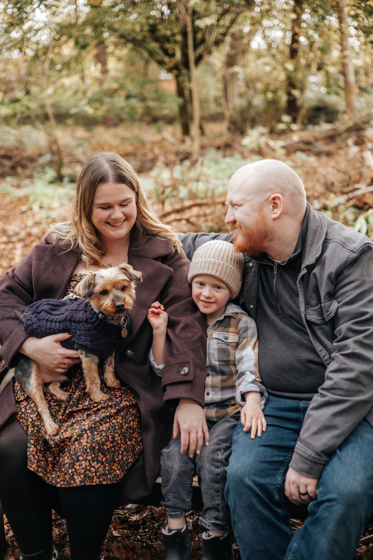 Family of four during photoshoot with dog friendly photographer in Telford.