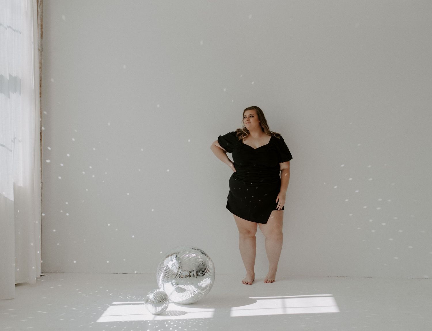 Artistic dance photography sequence in a bright white minimalist studio space.