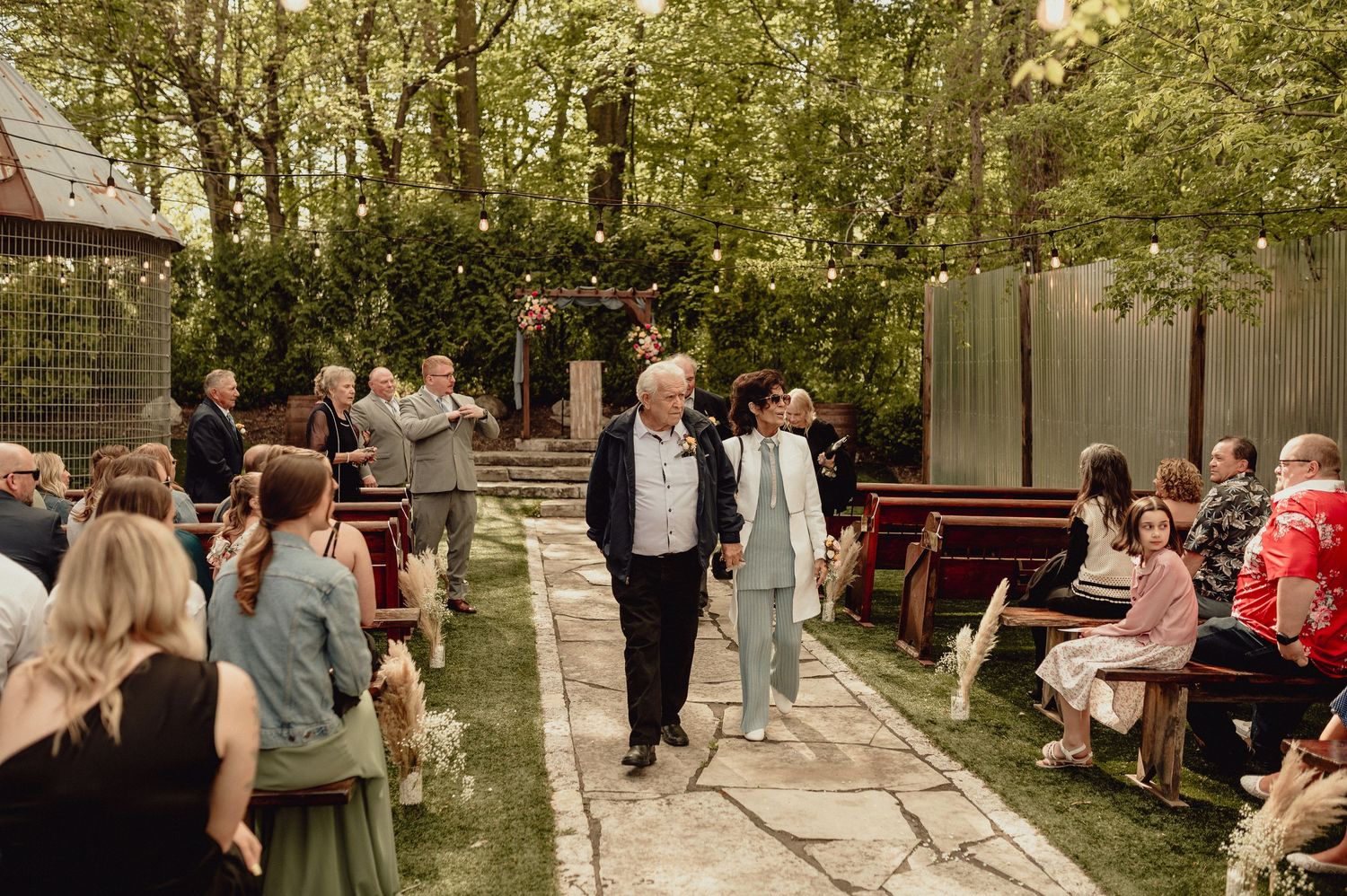 A series of outdoor wedding ceremony moments showing guests and celebrations in a garden setting.