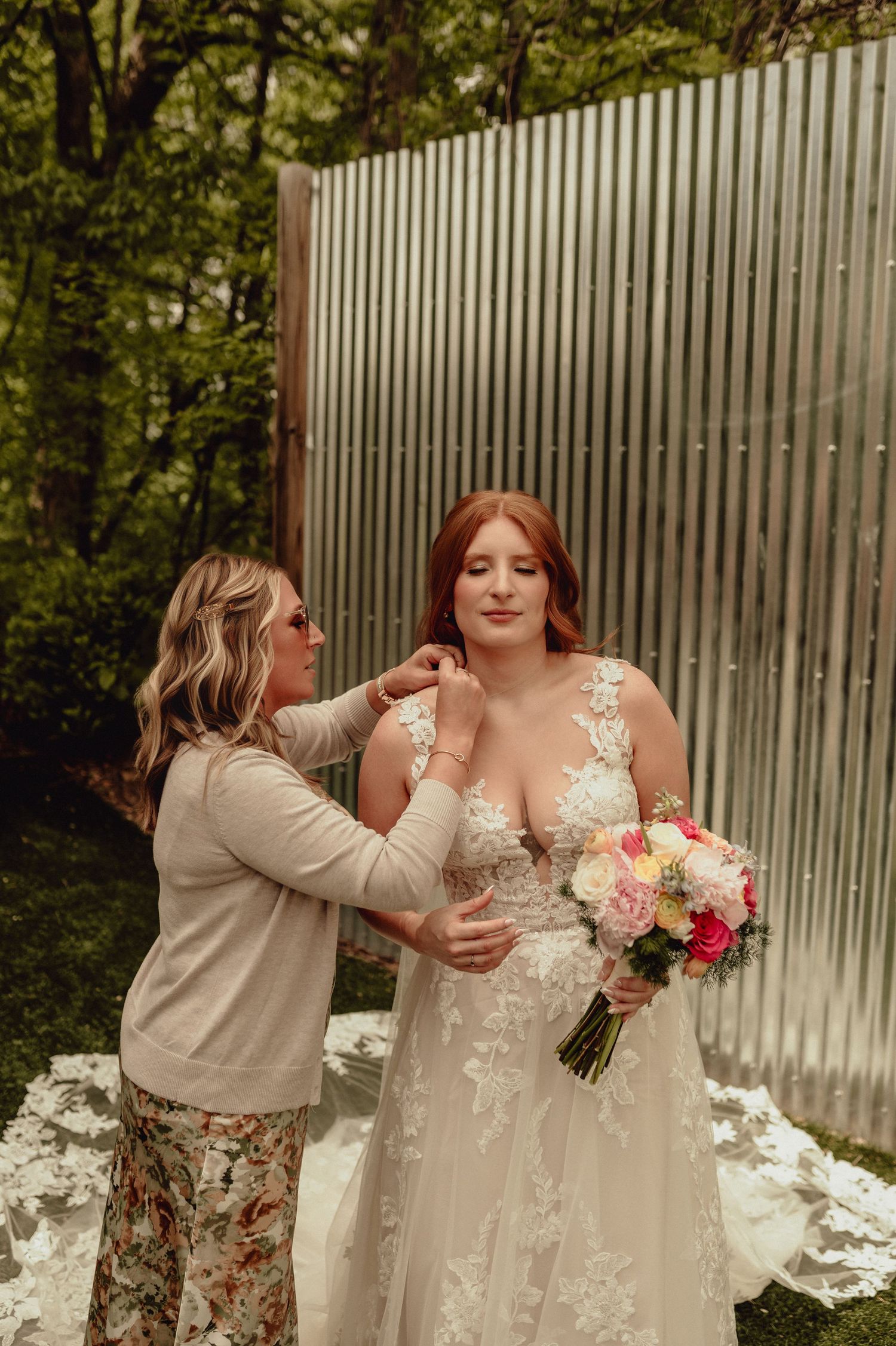 A wedding first look sequence showing emotional reactions between two people in formal attire with bouquet and white decor.