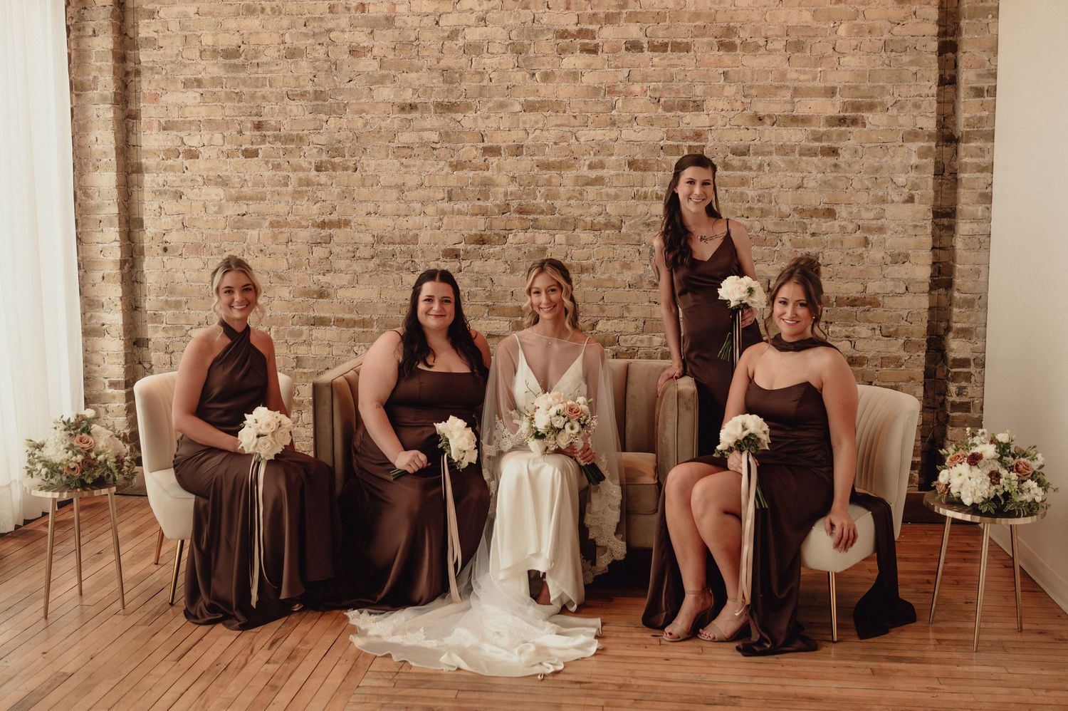 A series of wedding party photos showing bridesmaids in brown dresses sitting on rustic wooden benches against brick walls.