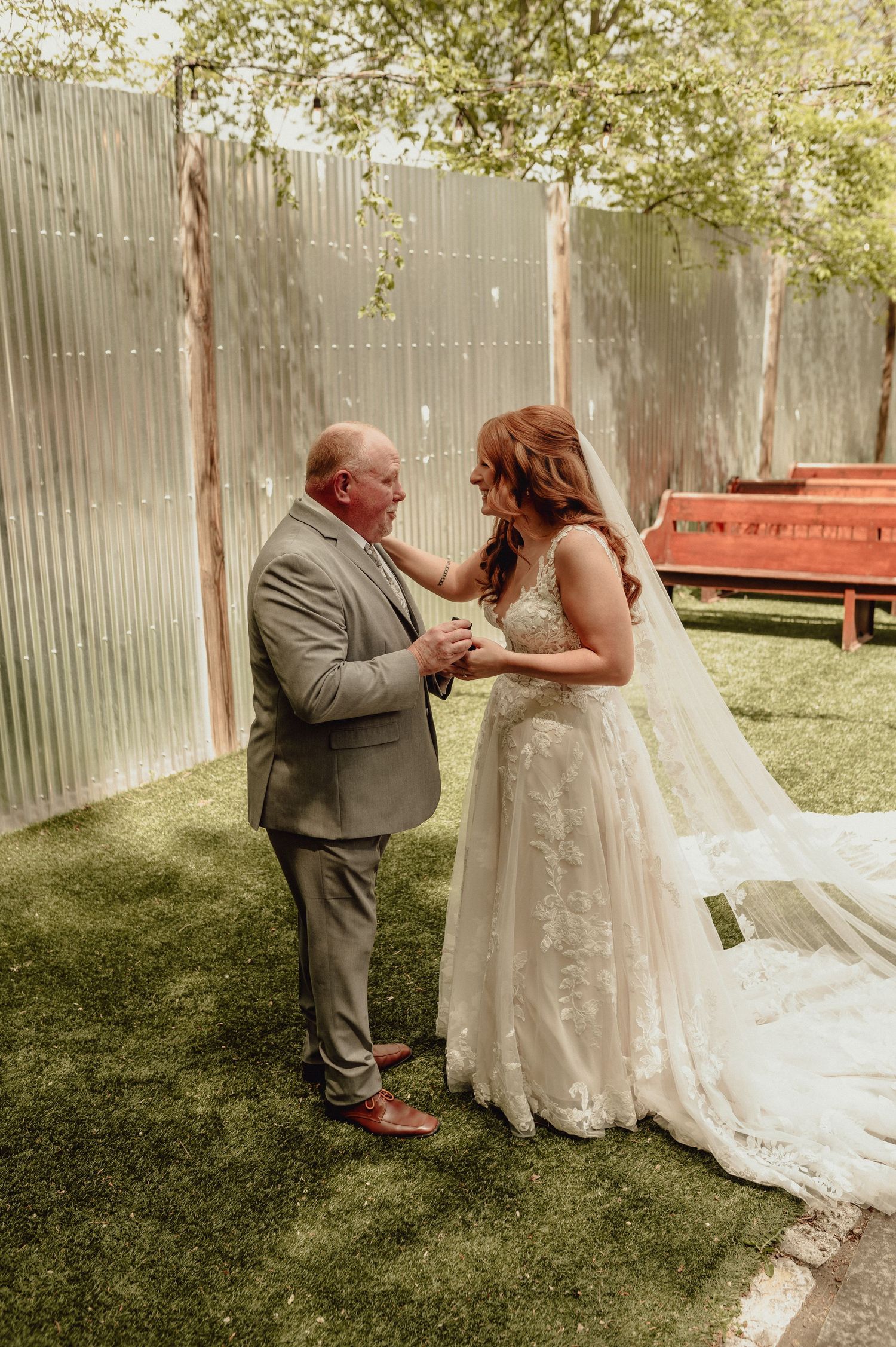 A series of candid moments captured in a backyard wedding setting with a wooden fence and green grass in the background.