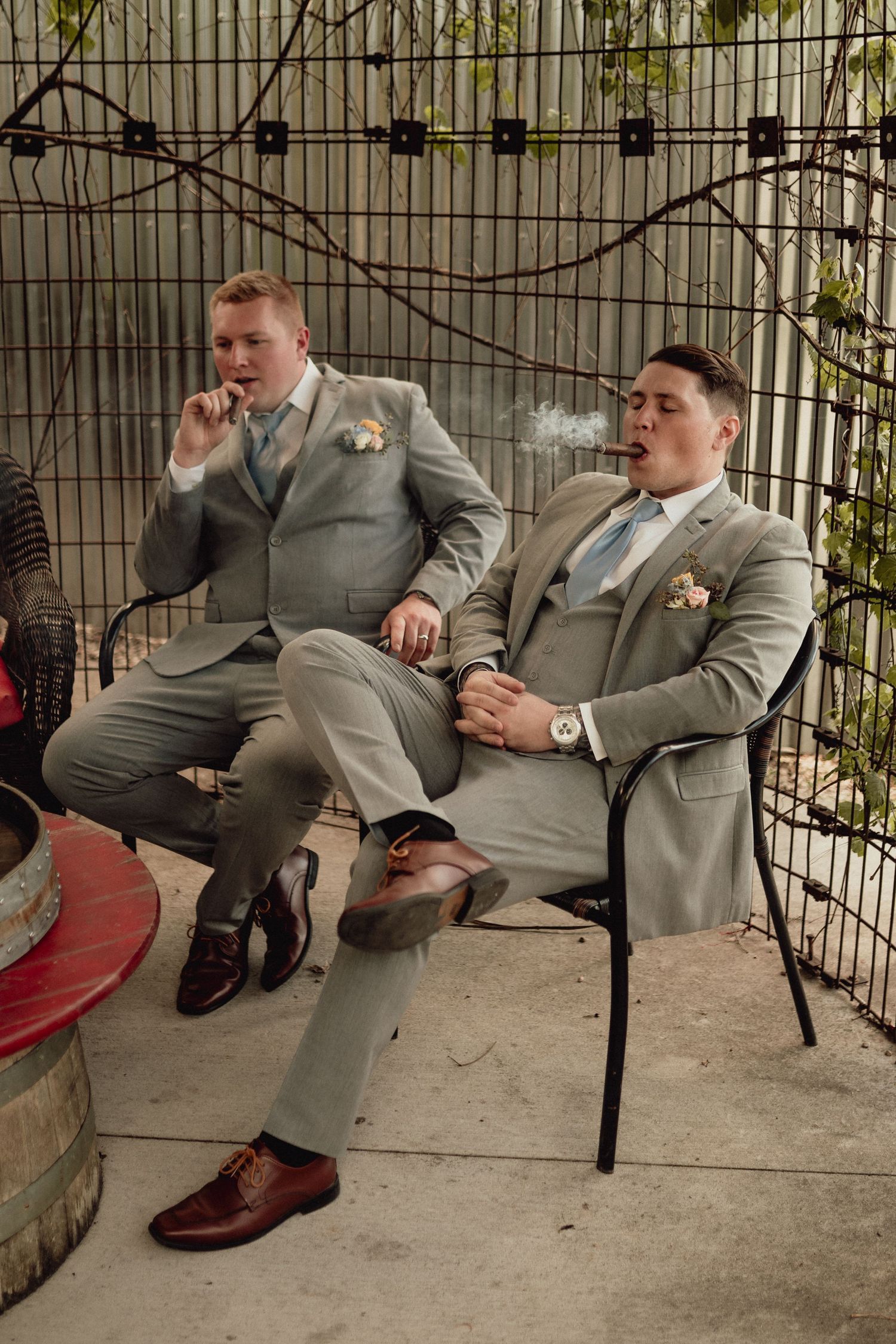 A sequence of photos showing someone in a gray suit falling backwards off a chair in a staged comedic moment.