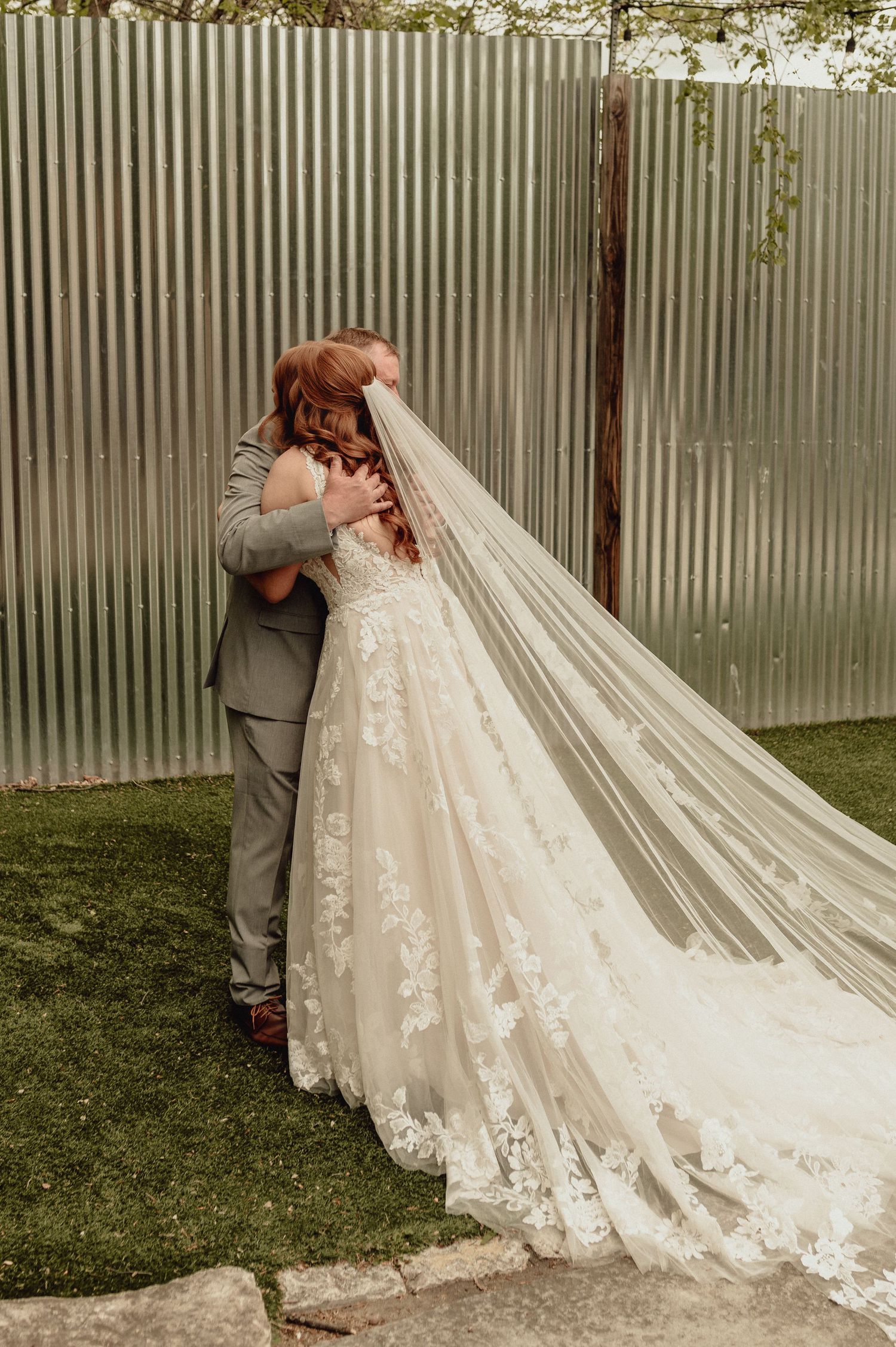 A series of wedding photos showing the back of an elegant lace wedding gown with a long flowing train in an outdoor setting.
