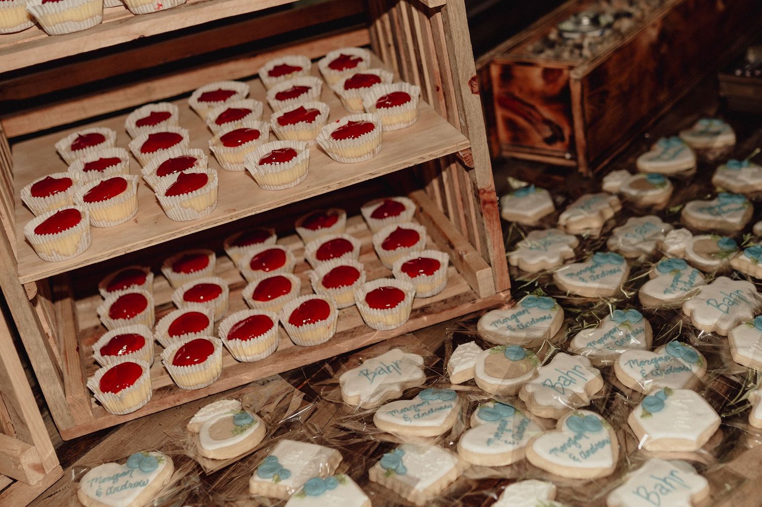 Rows of traditional Polish pierogi dumplings being prepared on wooden boards in a rustic kitchen setting.