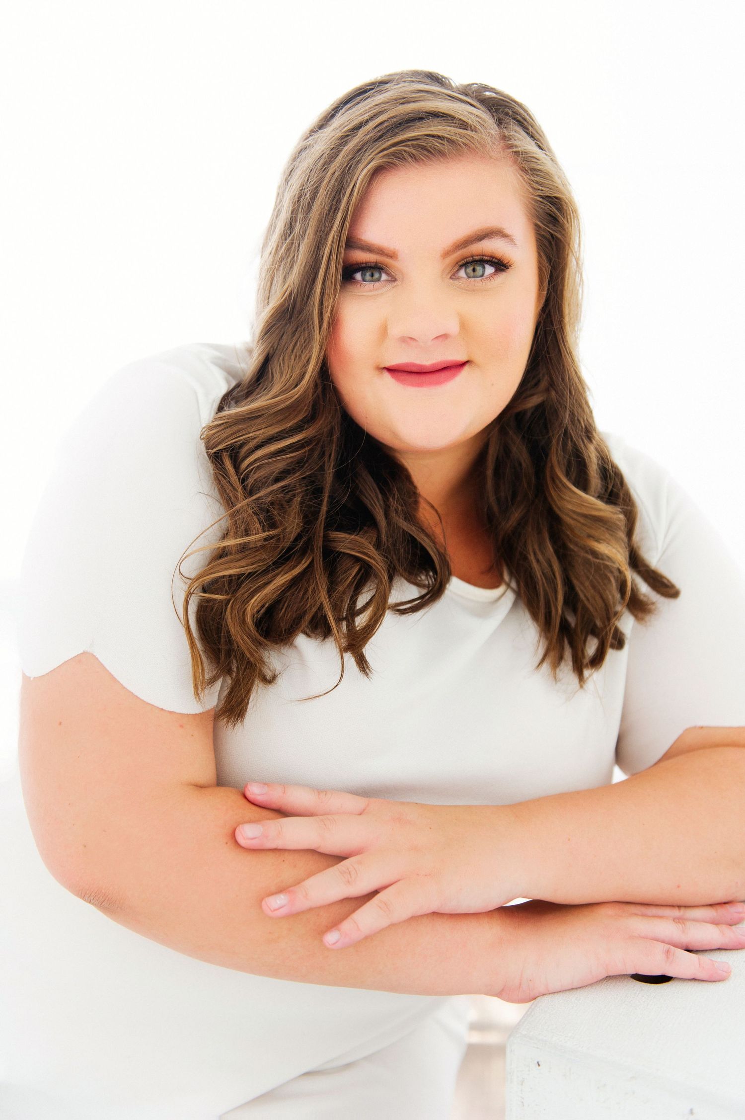 Portrait series in white showing warm expressions and relaxed poses against a light background.