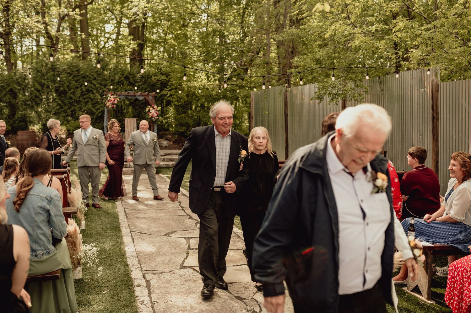A collage of outdoor wedding ceremony moments showing guests mingling in a garden setting.