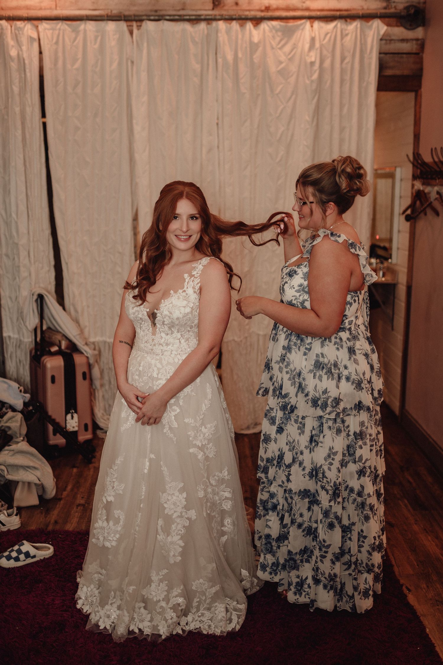 A sequence showing a young person in a white lace dress posing with another person in a floral print dress.