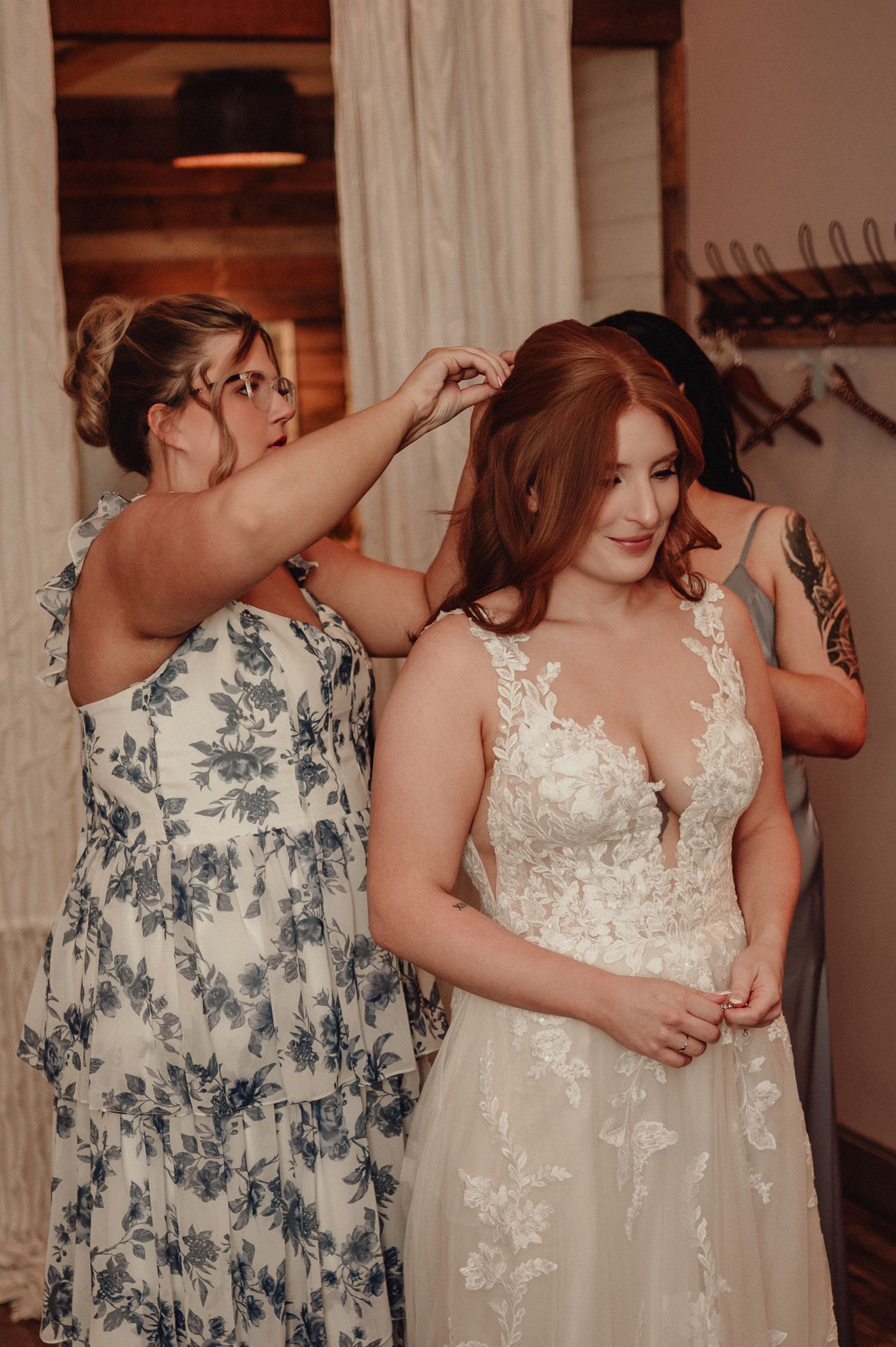 A tender moment captured in a sequence showing two people embracing in formal attire at an indoor venue.