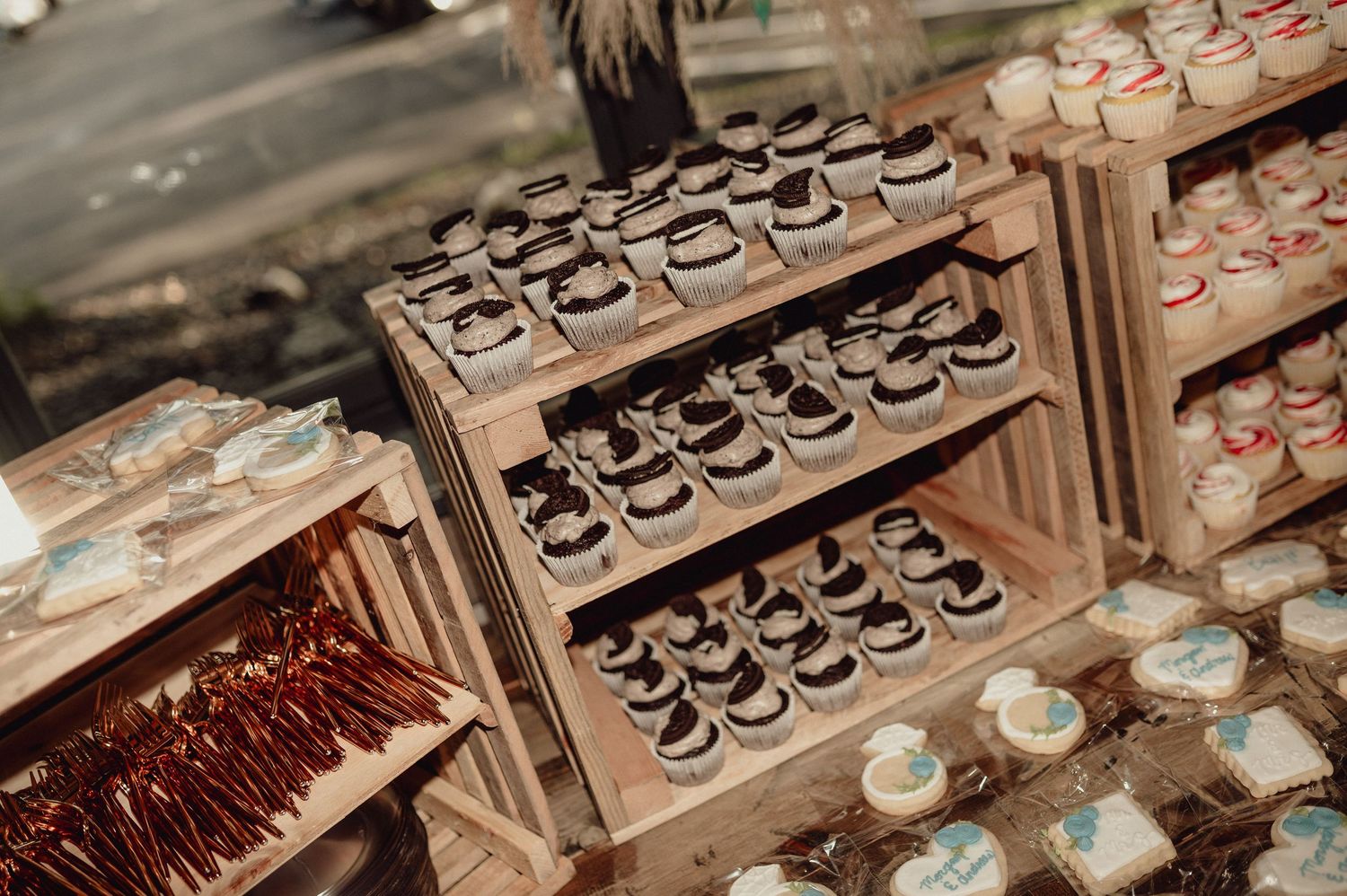 Rows of delicate chocolate desserts and pastries displayed in an elegant bakery case.
