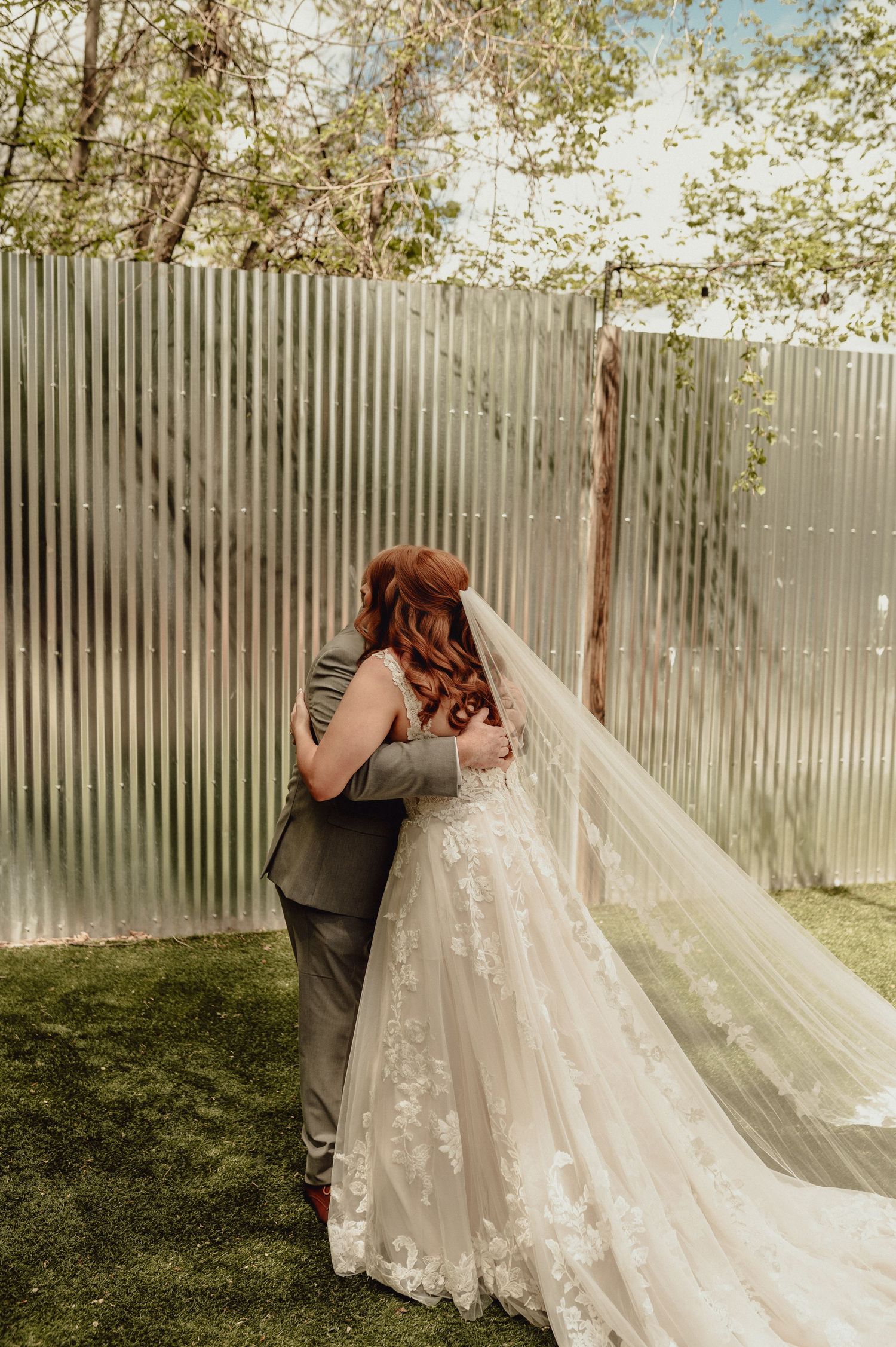 A series of photos showing a couple in wedding attire sharing a first look moment in an outdoor garden setting.