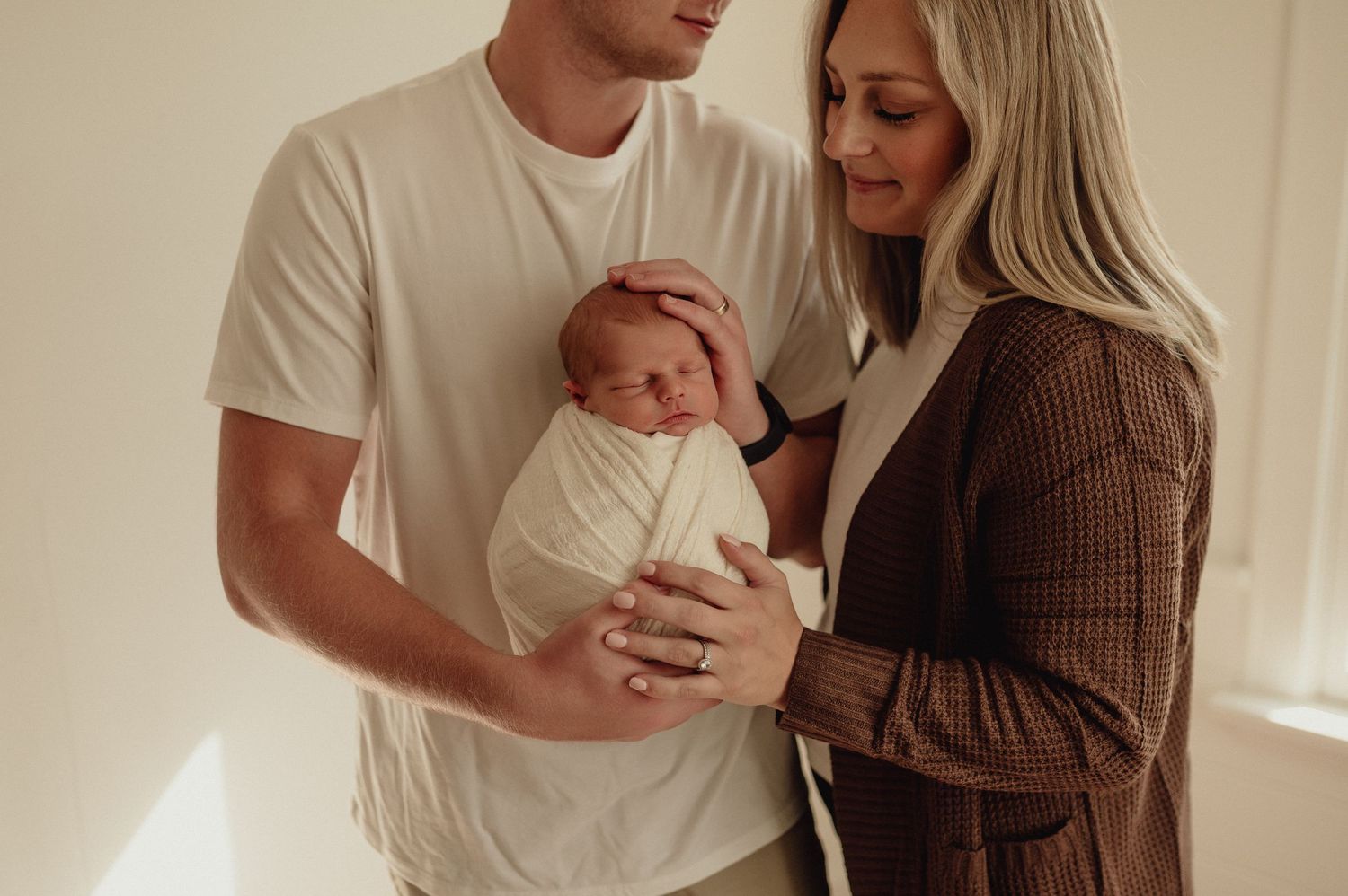 Intimate lifestyle photography session showing tender moments in casual attire.