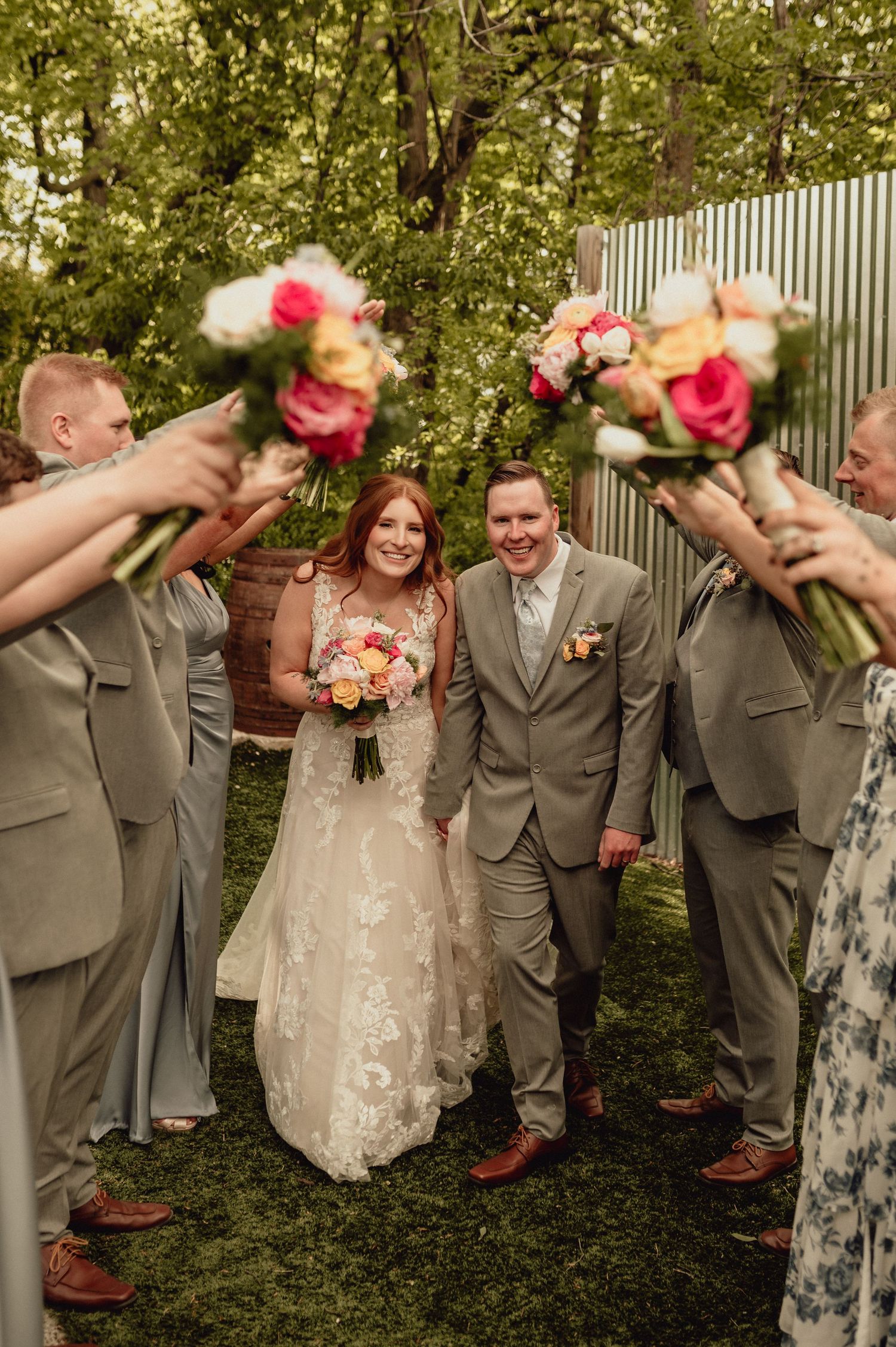 Wedding party members in gray suits and floral dresses pose playfully in a sequence of outdoor celebration photos.