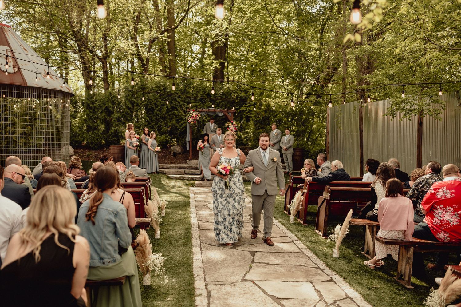 A series of outdoor wedding ceremony moments showing guests gathered in a wooded setting with natural decor.