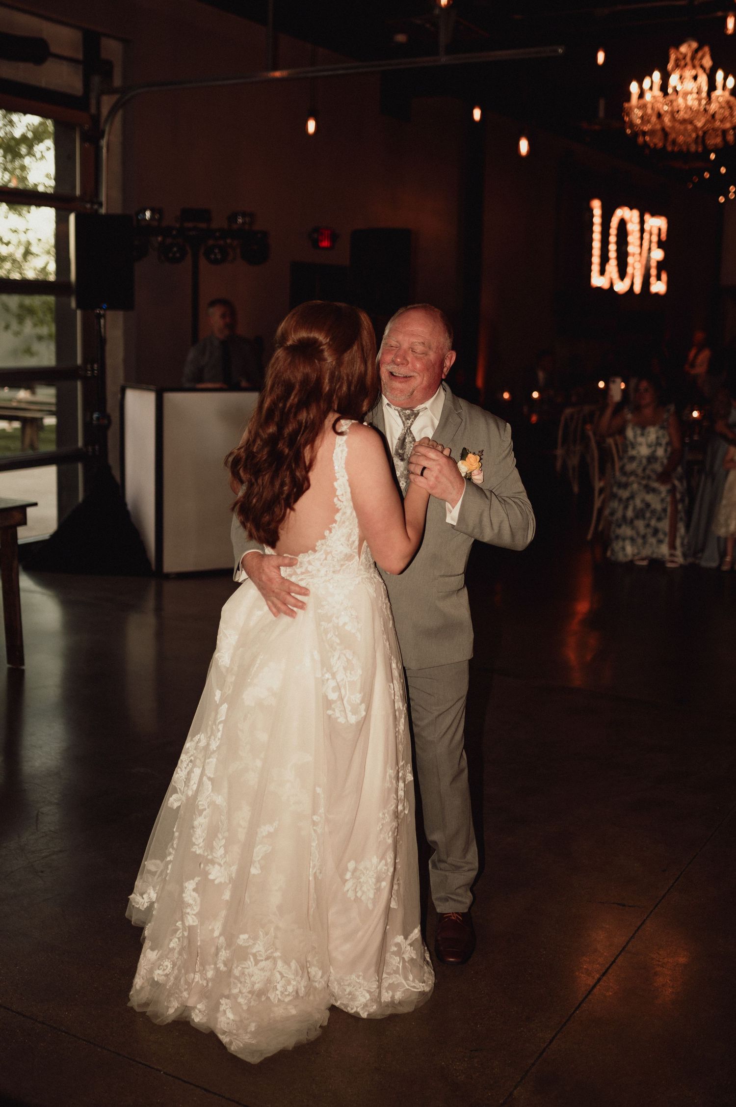 A series of dance photos showing a couple in formal attire dancing together at an elegant reception venue.