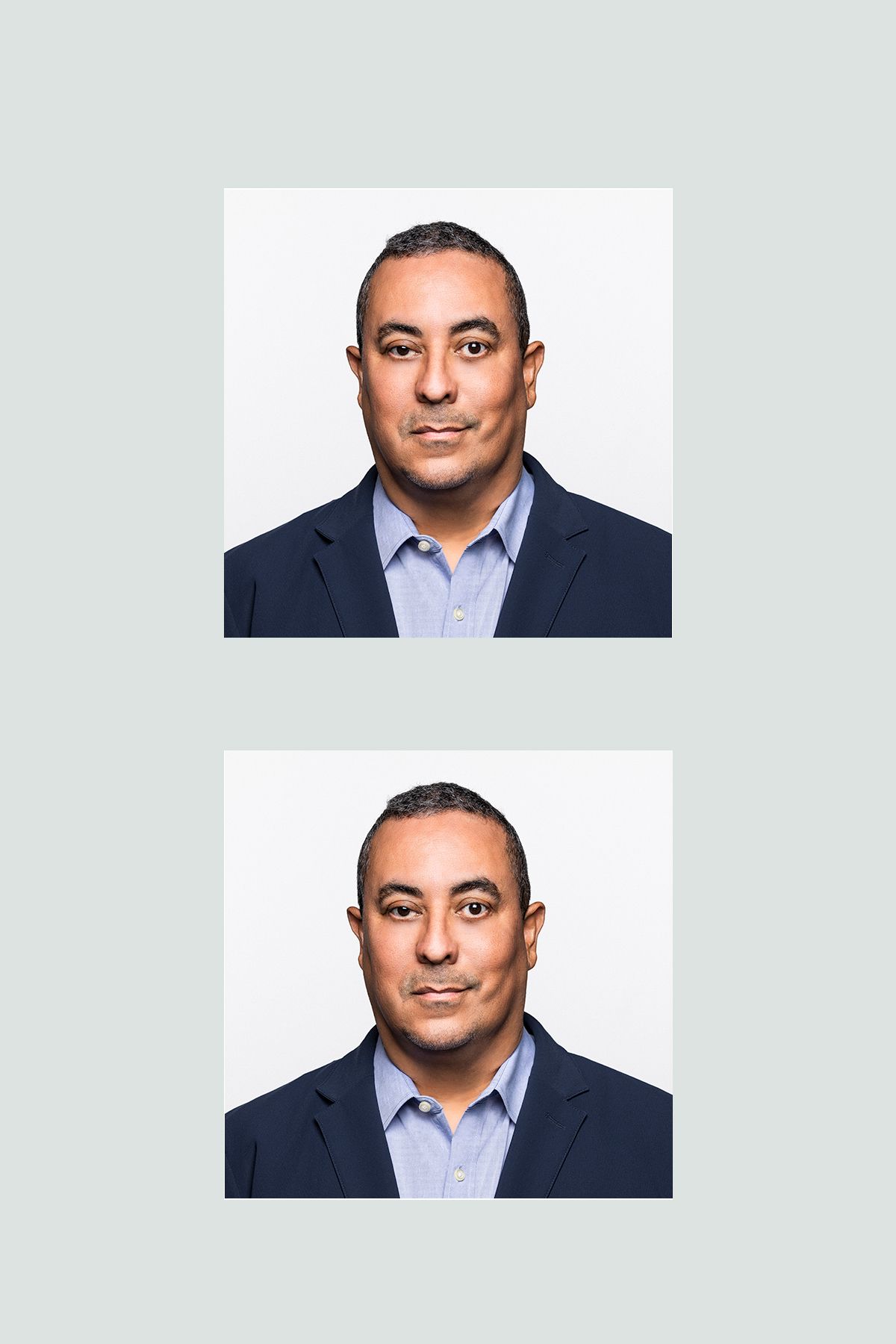Professional headshot of a person in a light blue button-down shirt against a light gray background.