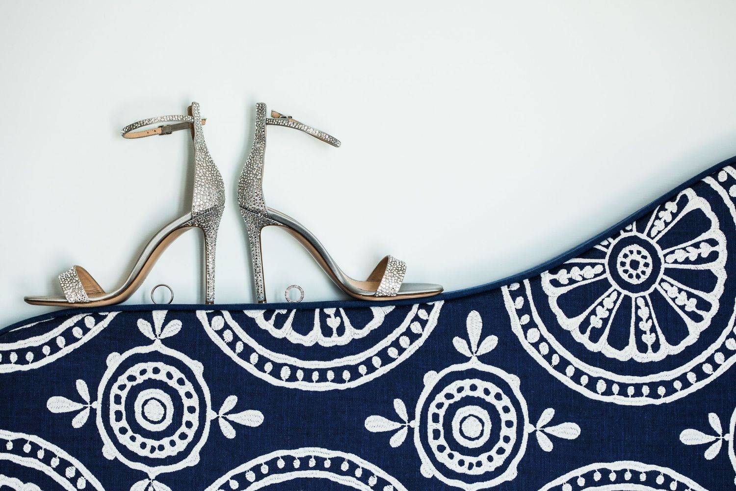 Navy and white paisley pattern design detail on fabric or paper.